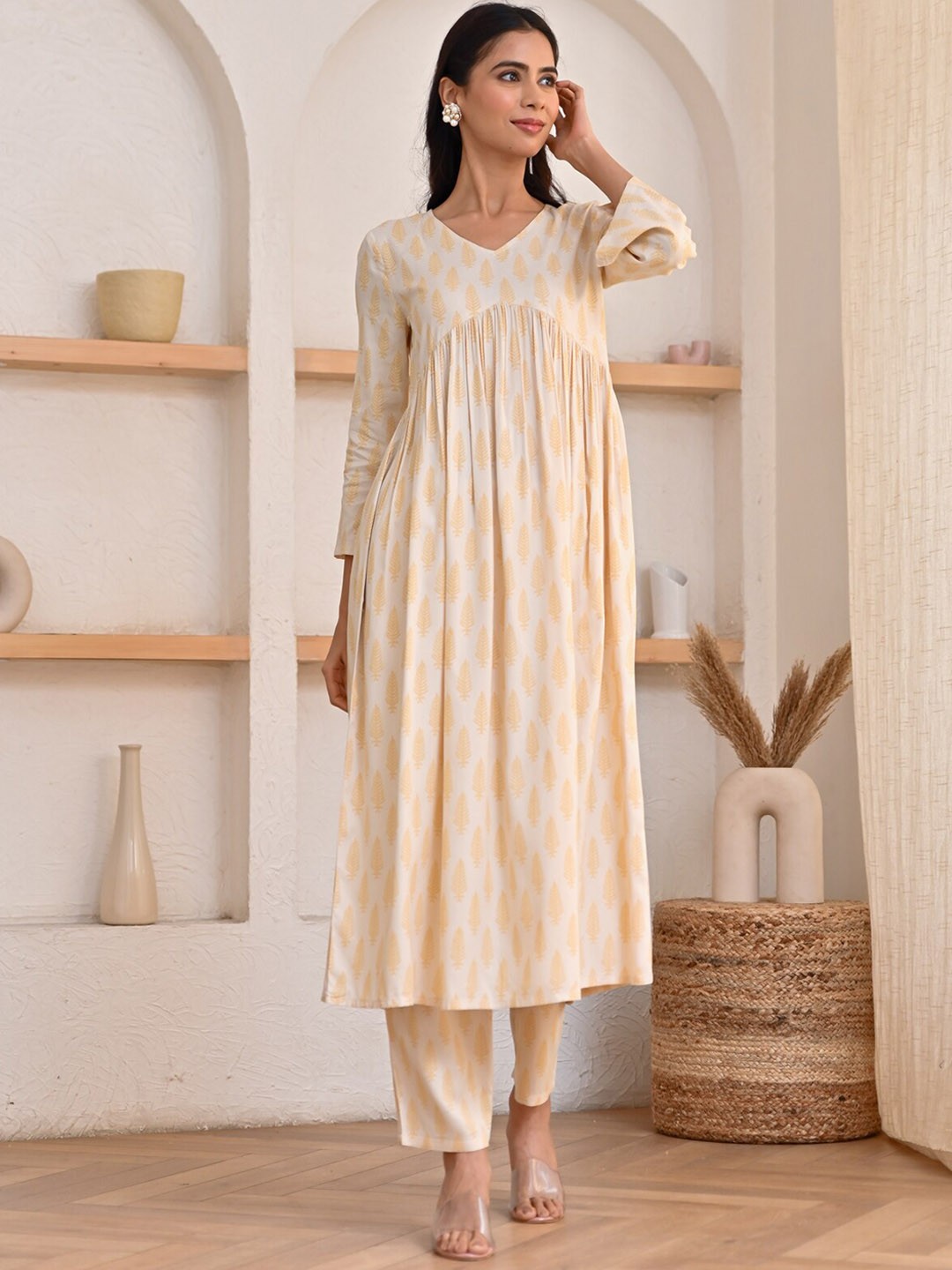 

Rustorange Ethnic Motifs Printed Pleated A-Line Kurta with Trousers, Cream