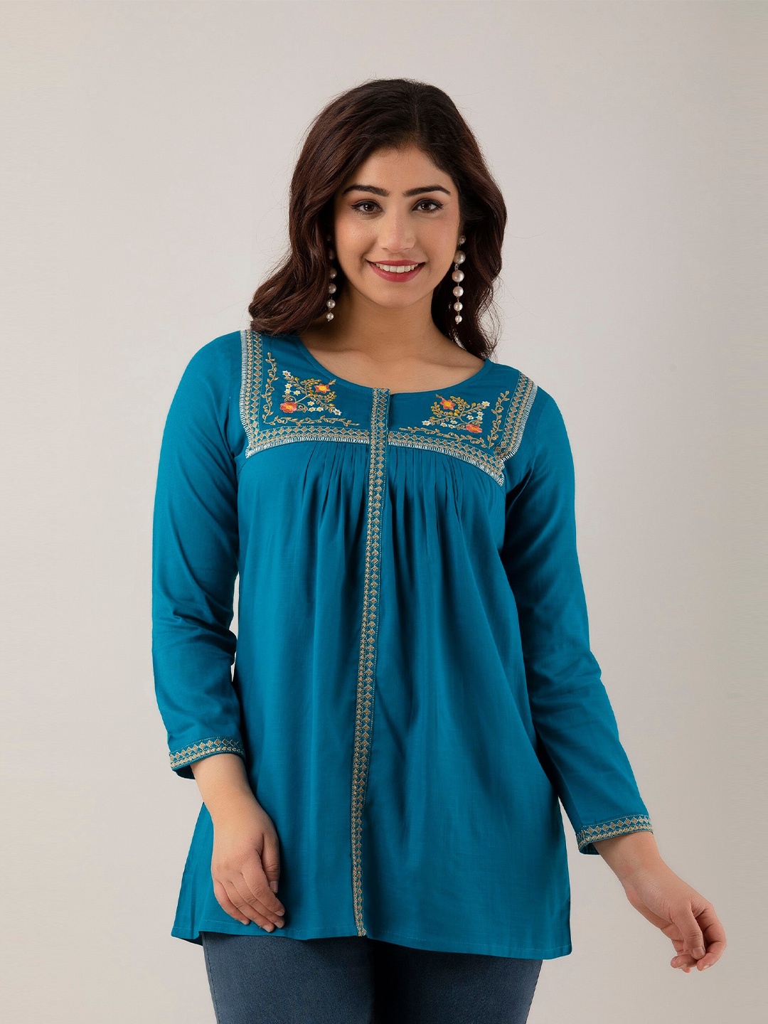 

Charu Floral Embroidered A-Line Top, Turquoise blue