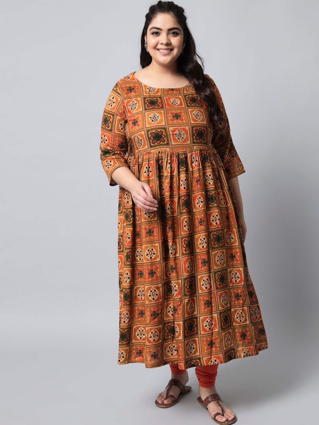 

Pankvi Plus Size Ethnic Motif Printed Beads & Stones A-Line Kurta, Mustard