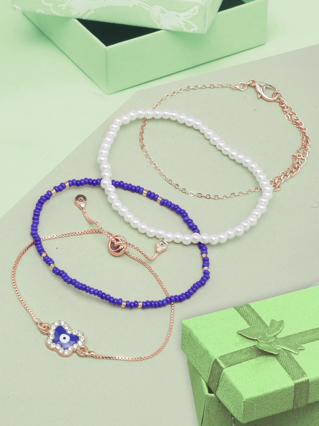 

DressBerry Women Set Of 4 Brass Rose Gold-Plated & Beaded Stone Studded Charm Bracelet