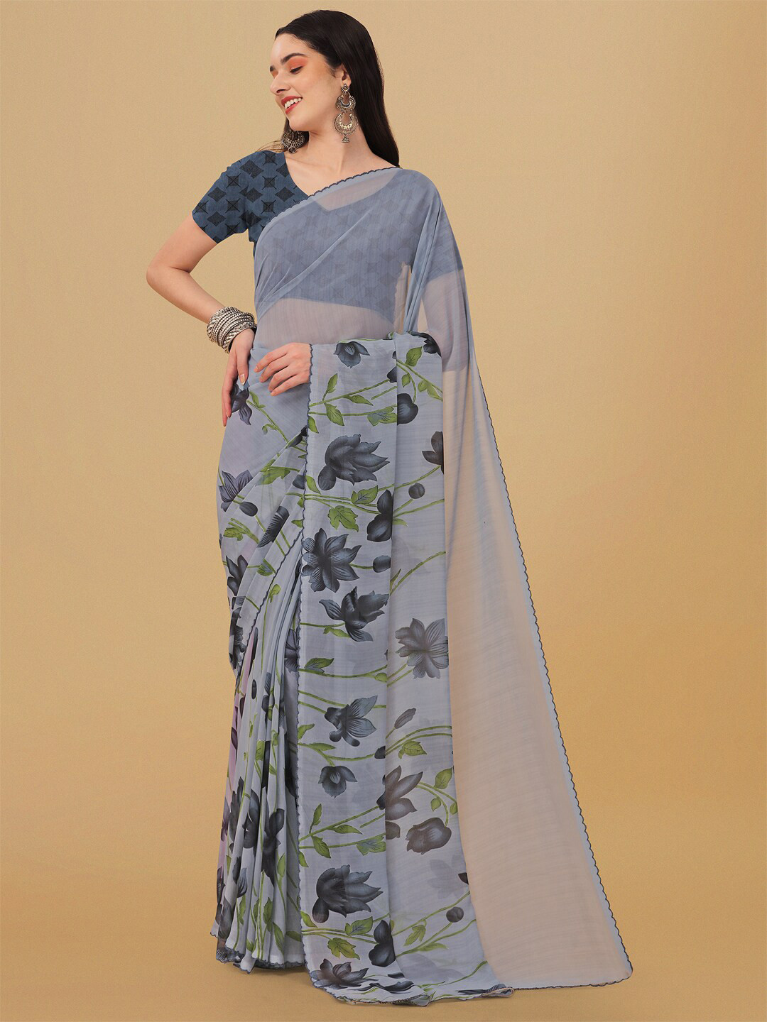 

Ambuja International Grey & Black Floral Poly Georgette Saree