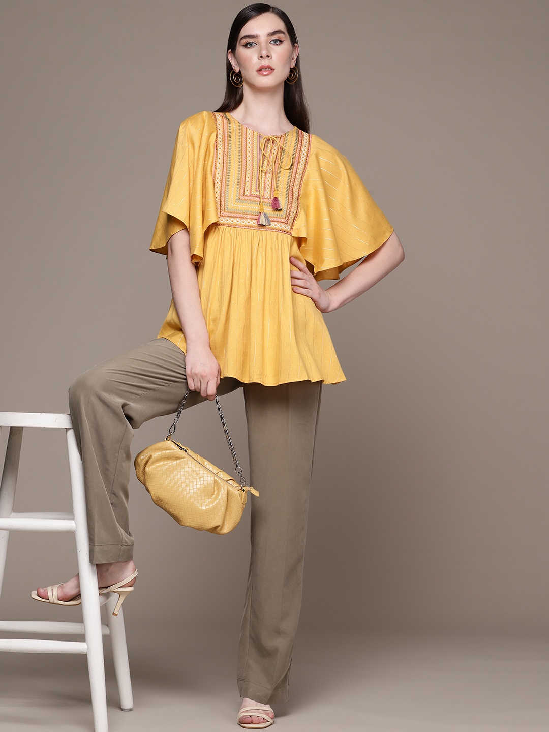 

aarke Ritu Kumar Geometric Embroidered Tie-Up Neck Flared Sleeve Top, Yellow