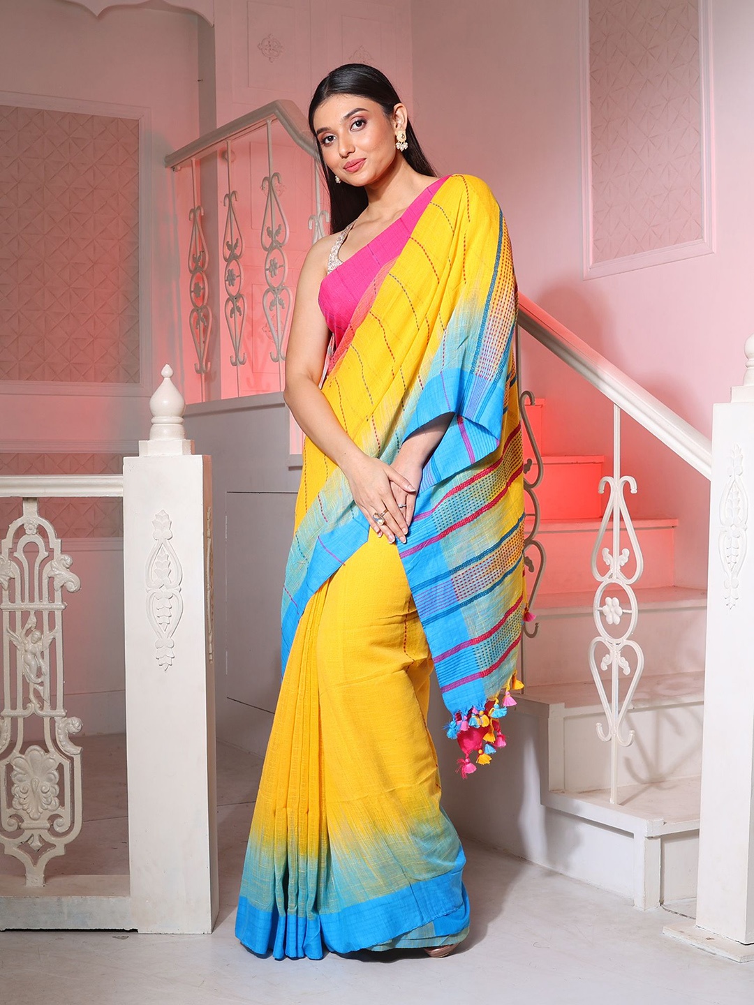 

Charukriti Yellow & Blue Striped Pure Cotton Ikat Saree