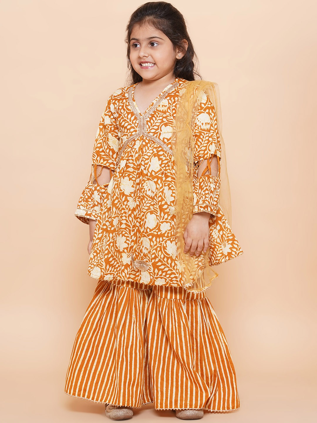 

Aj DEZInES Girls Printed Gotta Patti A-Line Pure Cotton Kurta with Sharara & Dupatta, Mustard