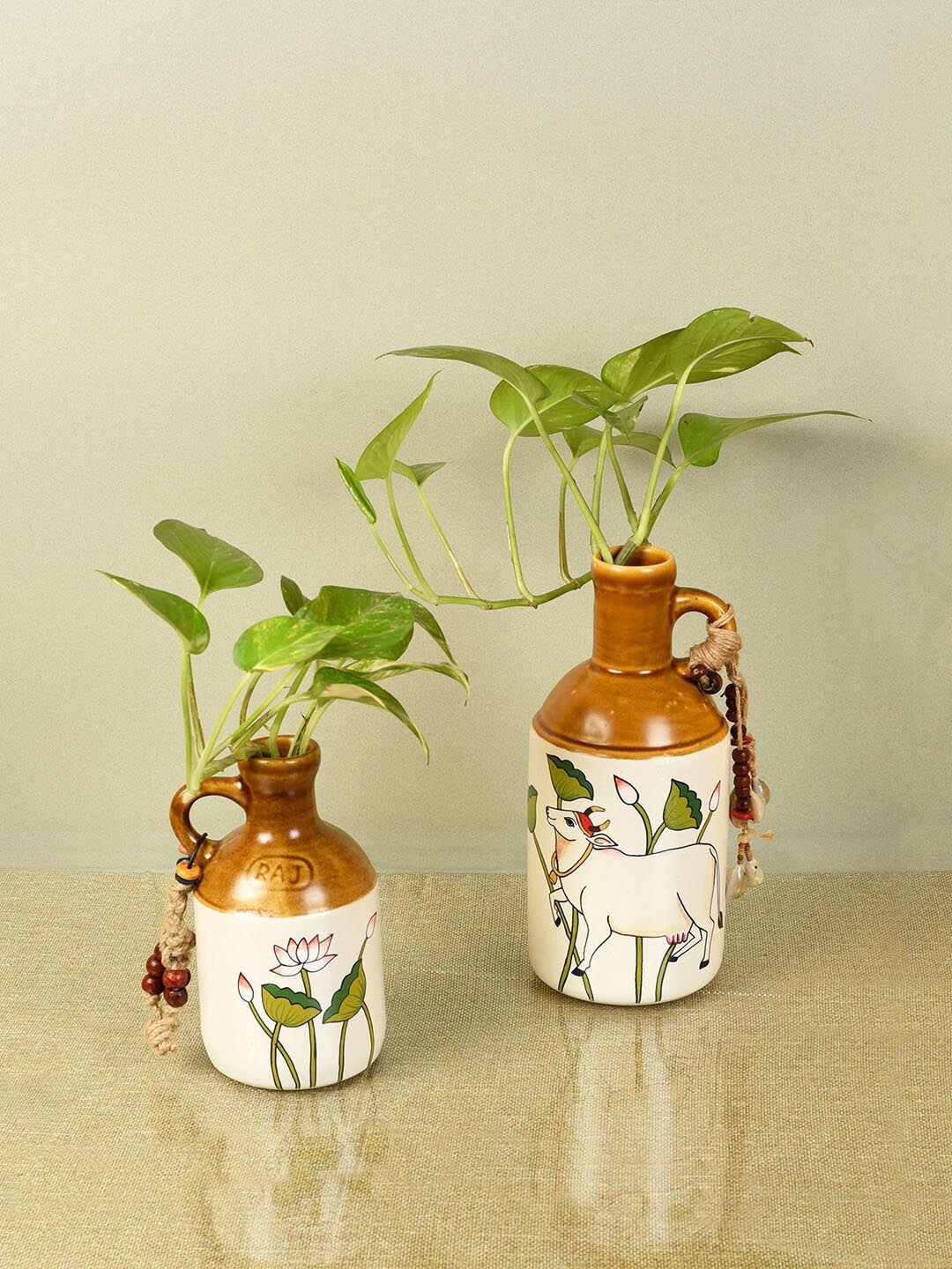 

AAKRITI ART CREATIONS 2 Pieces Off-White & Brown Printed Ceramic Planter Bottles