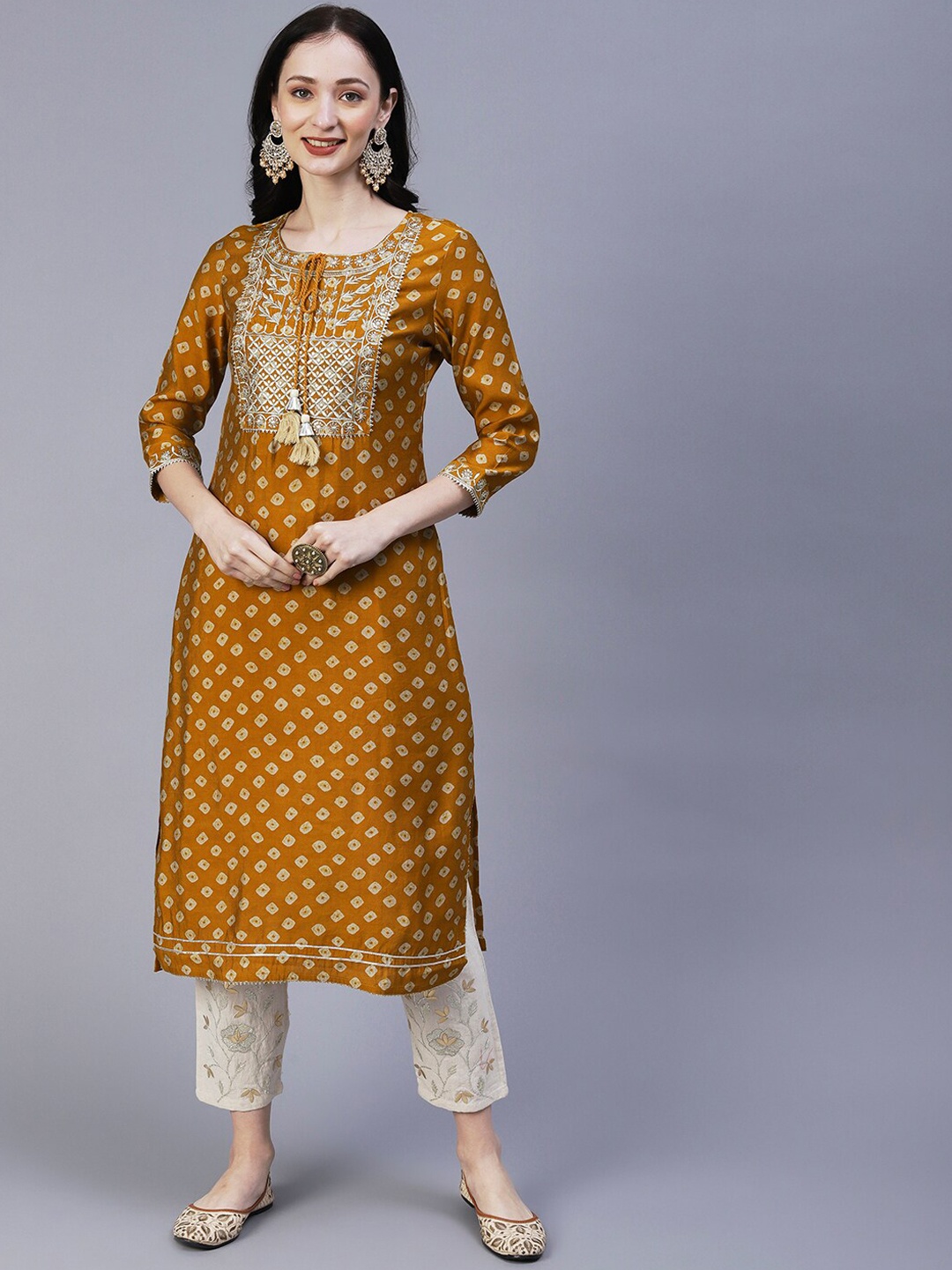 

FASHOR Bandhani Printed Tie Up Neck Thread Work Straight Kurta, Mustard