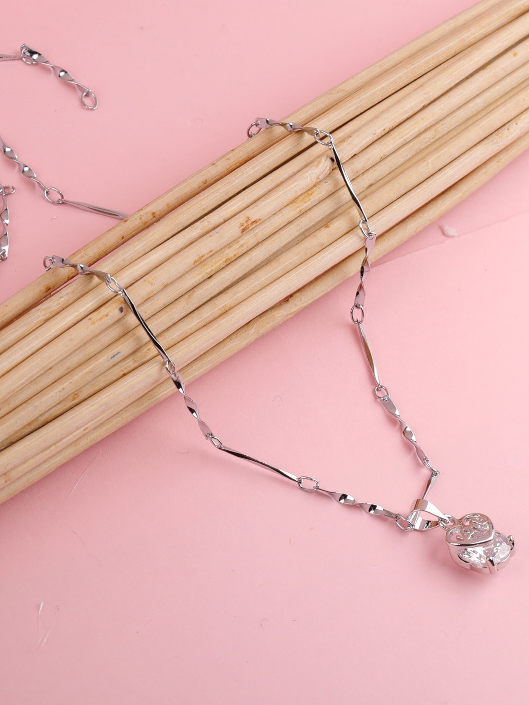 

Silver Shine Silver-Plated AD-Studded Couple Rings And Pendant Chain Jewellery Set