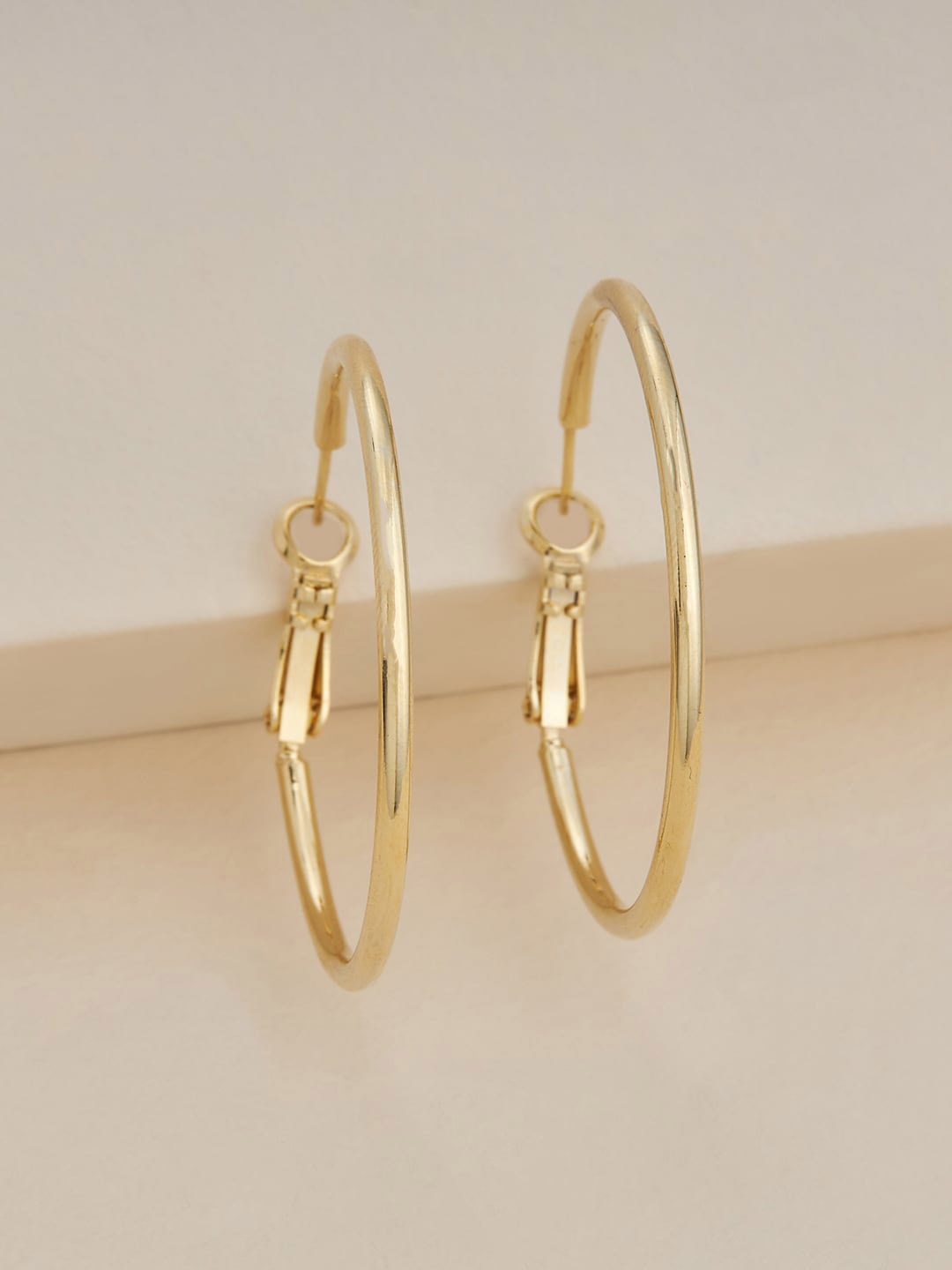 

Kushal's Fashion Jewellery Gold-Plated Contemporary Hoop Earrings
