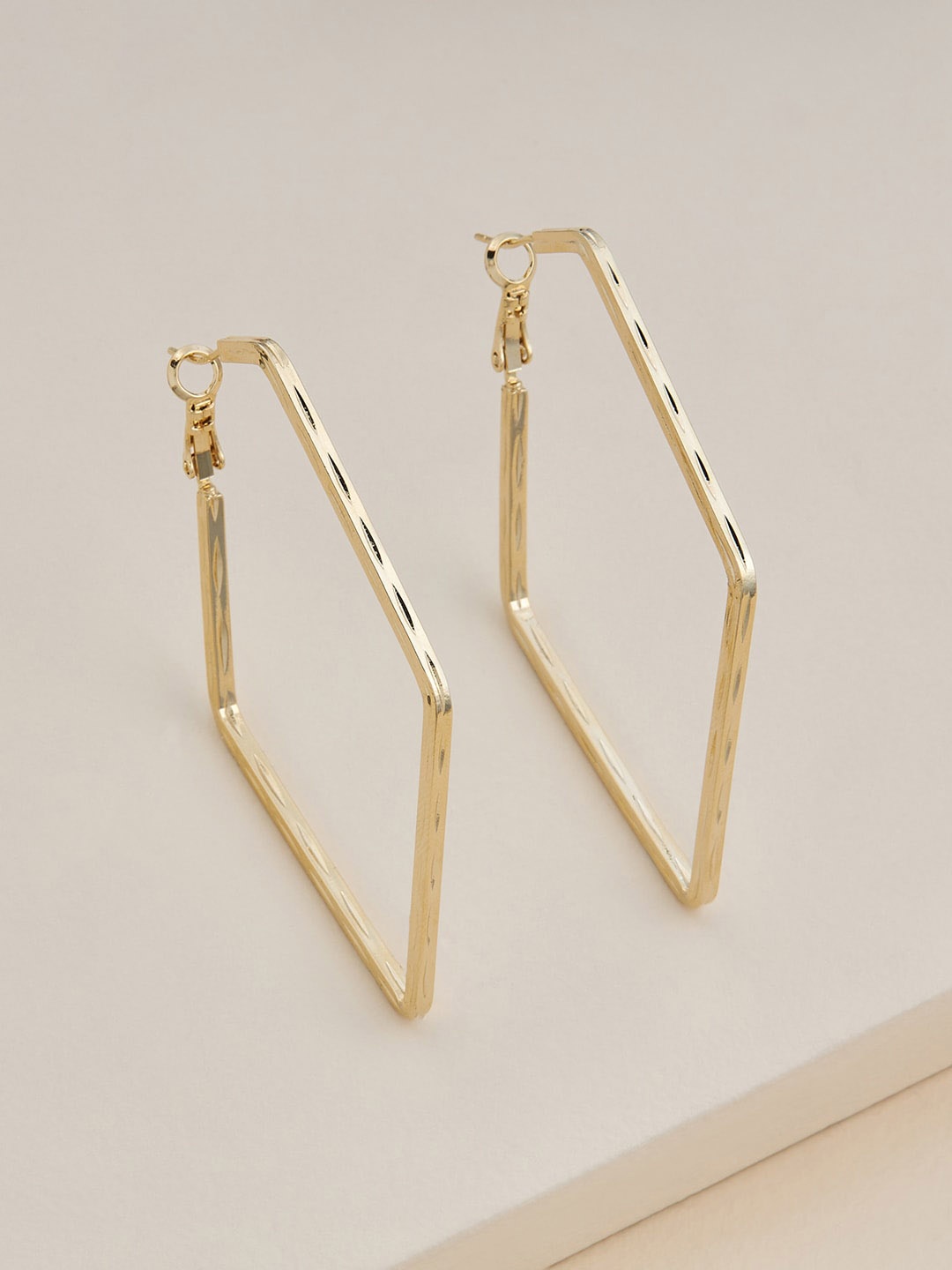 

Kushal's Fashion Jewellery Gold-Plated Contemporary Hoop Earrings