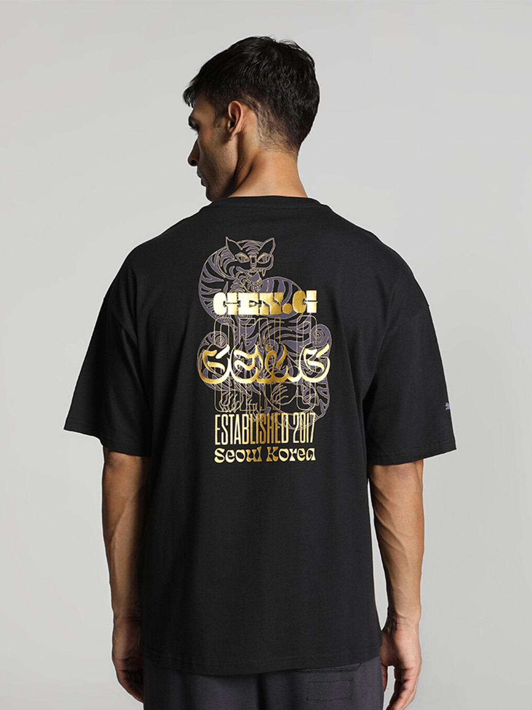 

Puma Gen.G Logo-Printed Oversized Fit Knitted Cotton T-Shirt, Black