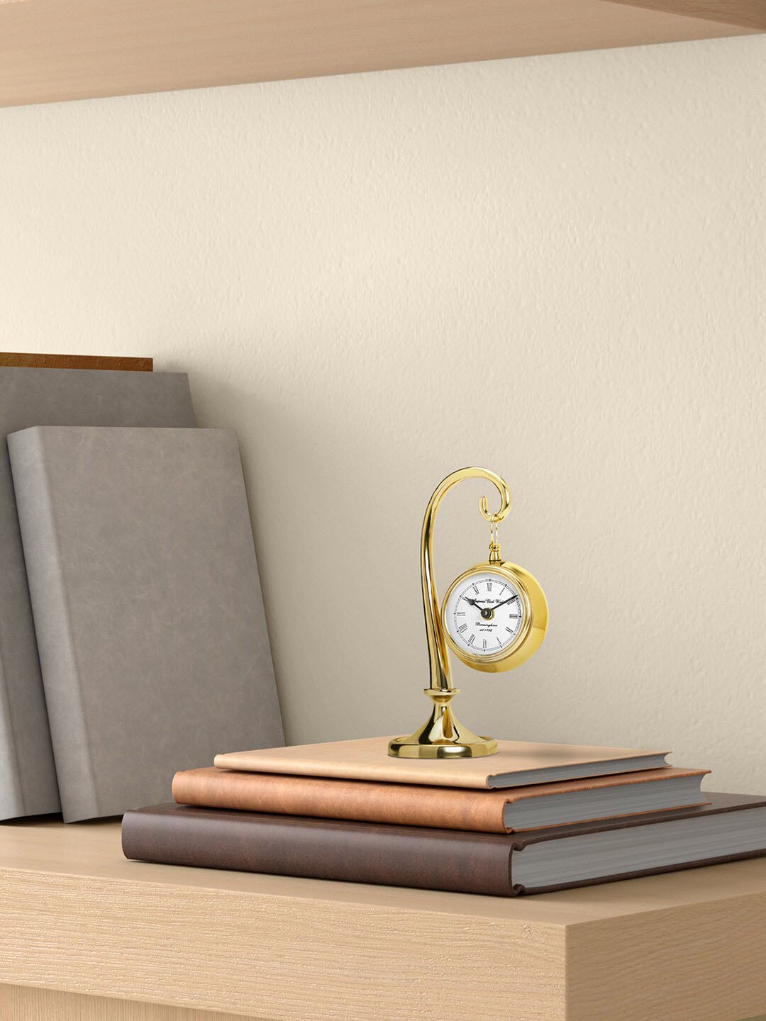 

Living scapes by Pantaloons Gold-Toned & White Abstract Shaped Contemporary Table Clock