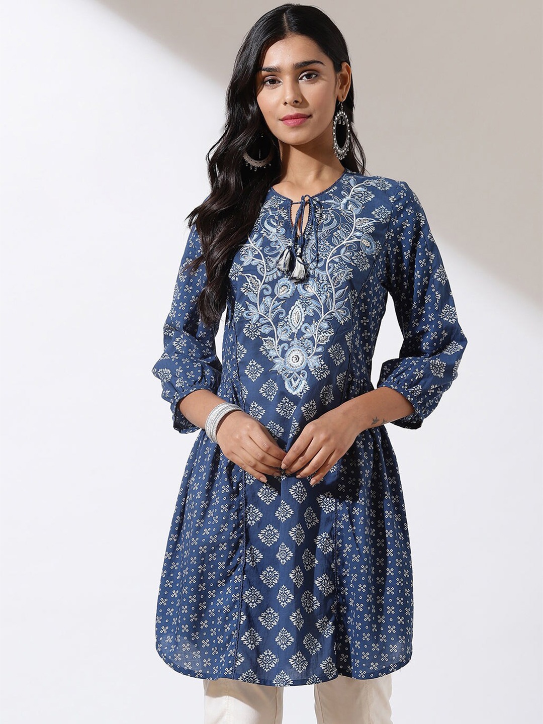 

Lakshita Ethnic Motifs Printed Tie Up Neck Thread Work Pure Cotton Kurti, Navy blue