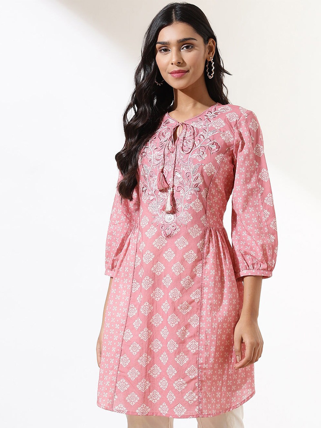 

Lakshita Ethnic Motifs Printed Tie Up Neck Thread Work Pure Cotton Kurti, Peach