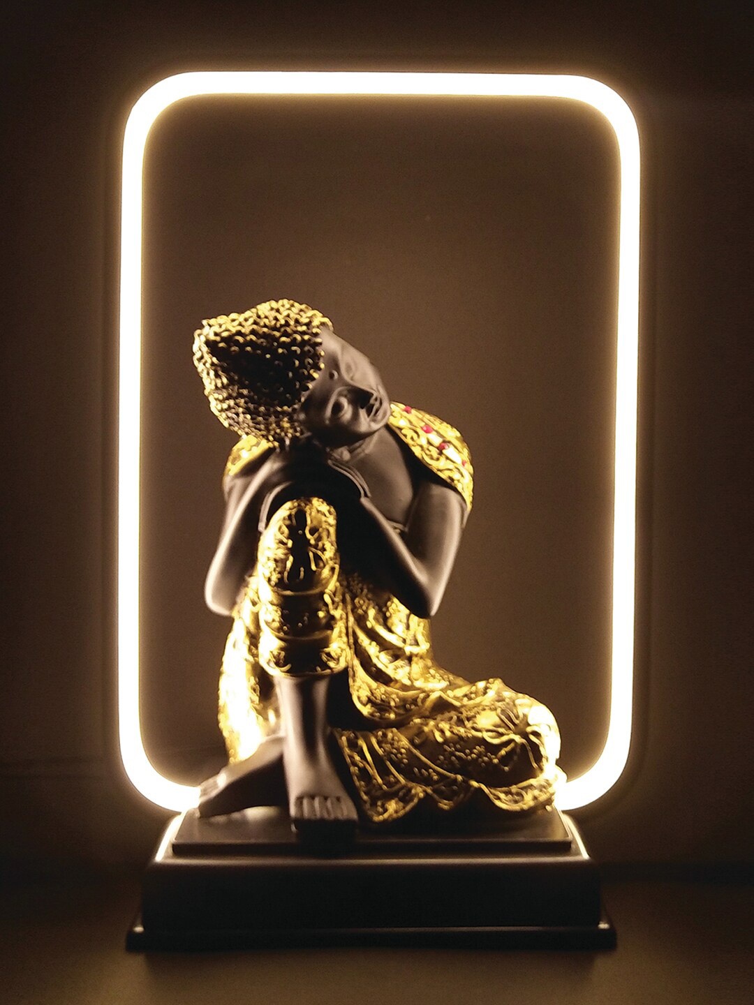 

WENS Black & Gold Toned Gautama Buddha Statue With LED Light Showpiece