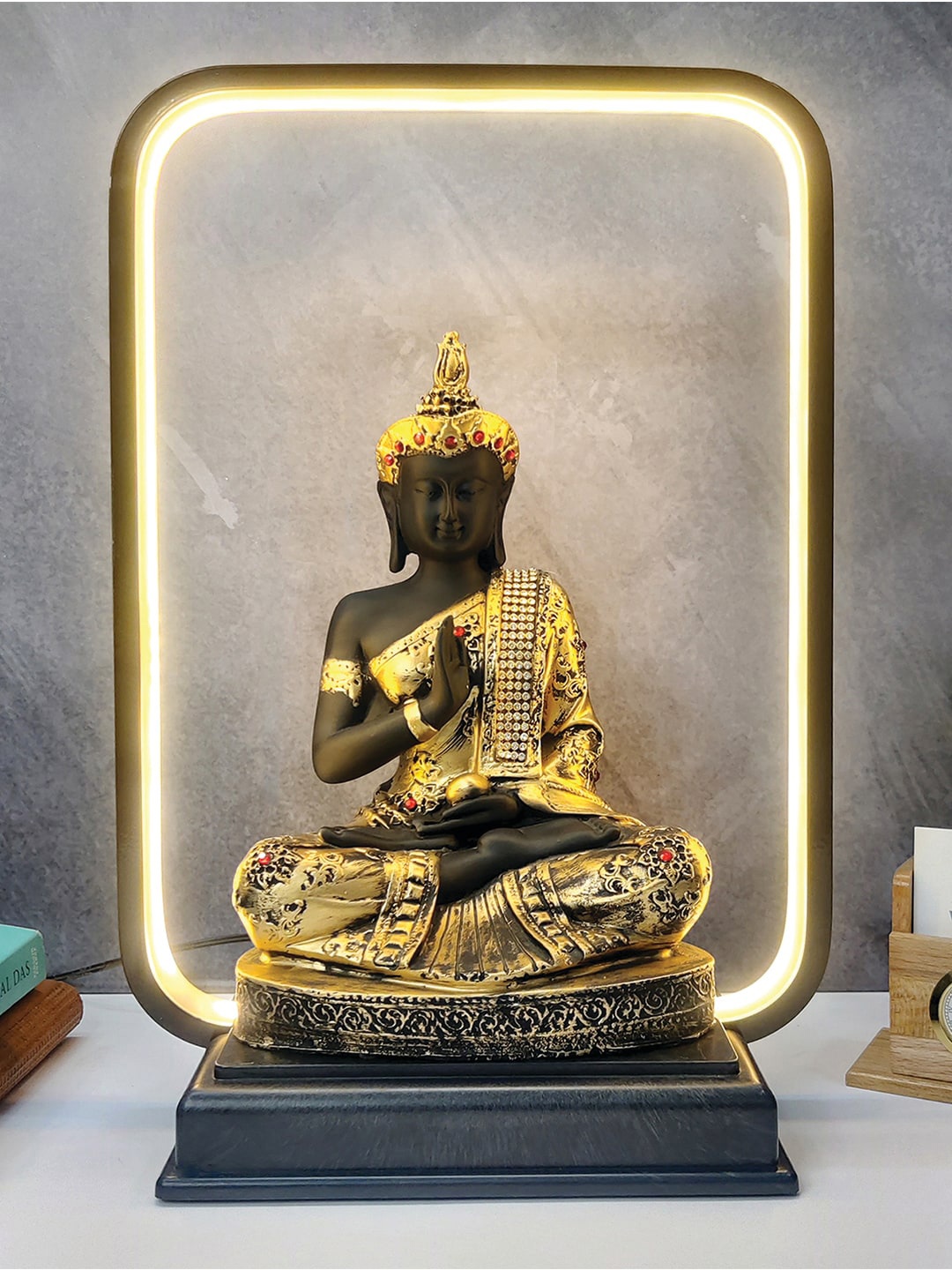 

WENS Black & Gold Toned Gautama Buddha Statue With LED Light Showpiece