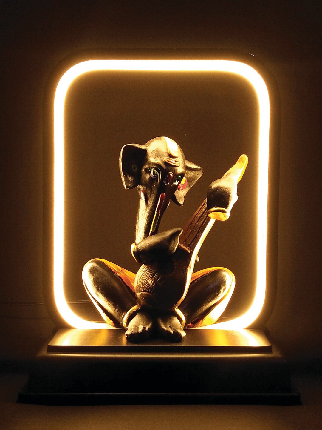 

WENS Black & Gold Toned Palm Musical Ganesha Led Lamp Showpiece