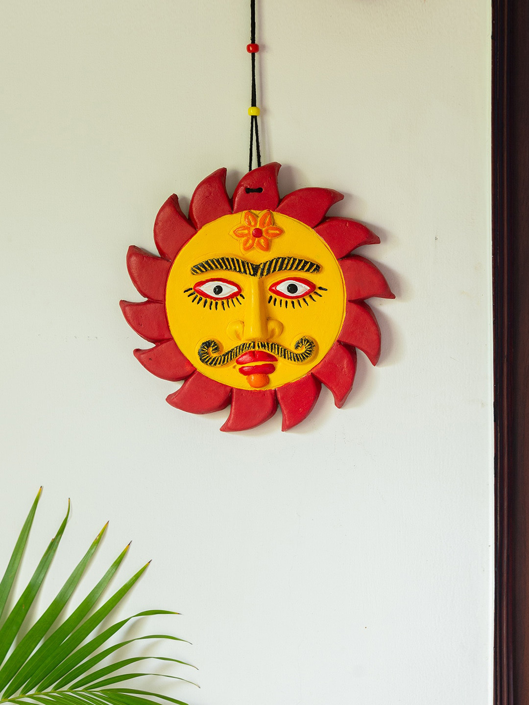 

ExclusiveLane Hymns Of Childhood Yellow & Red Printed Sun Deity Terracotta Wall Hanging