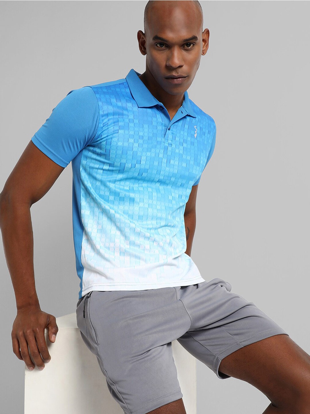 

Campus Sutra Abstract Polo Collar Activewear T-shirt, Blue