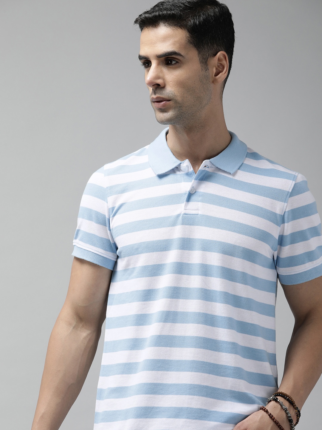 

Roadster Men Striped Polo Collar T-shirt, Blue
