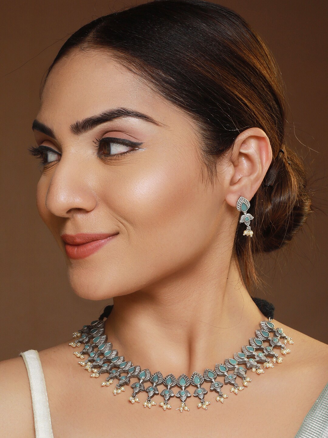 

Priyaasi Silver-Plated Studded Floral Leaf Oxidised Jewellery Set