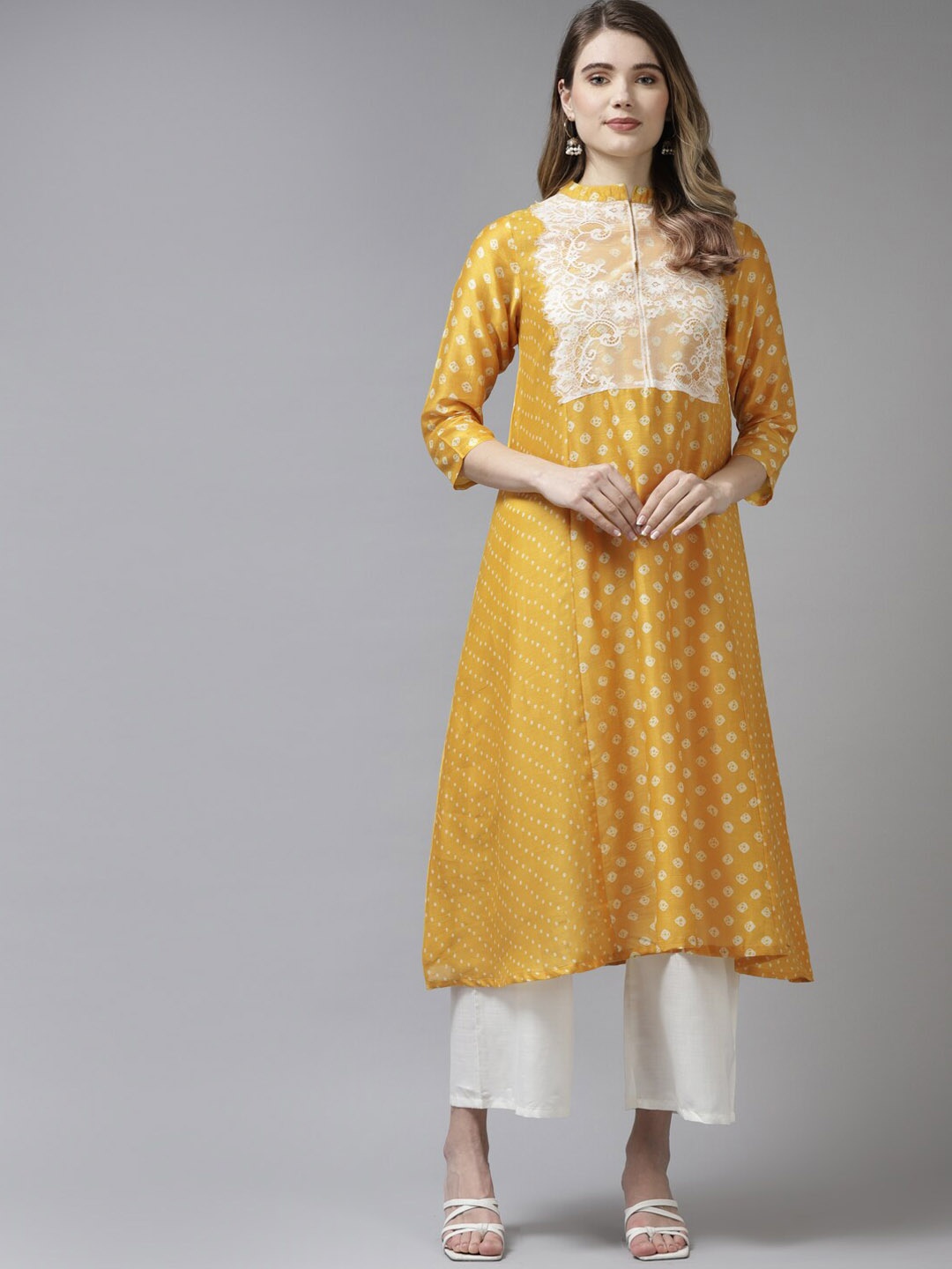 

Bhama Couture Bandhani Printed Lace Up Detail A-Line Kurta with Palazzos, Mustard