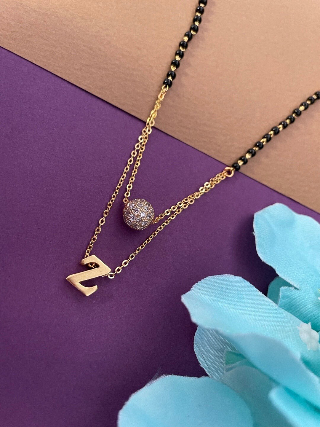 

Digital Dress Room Gold-Plated Z Letter Shape AD Stone-Studded Ball & Beaded Mangalsutra