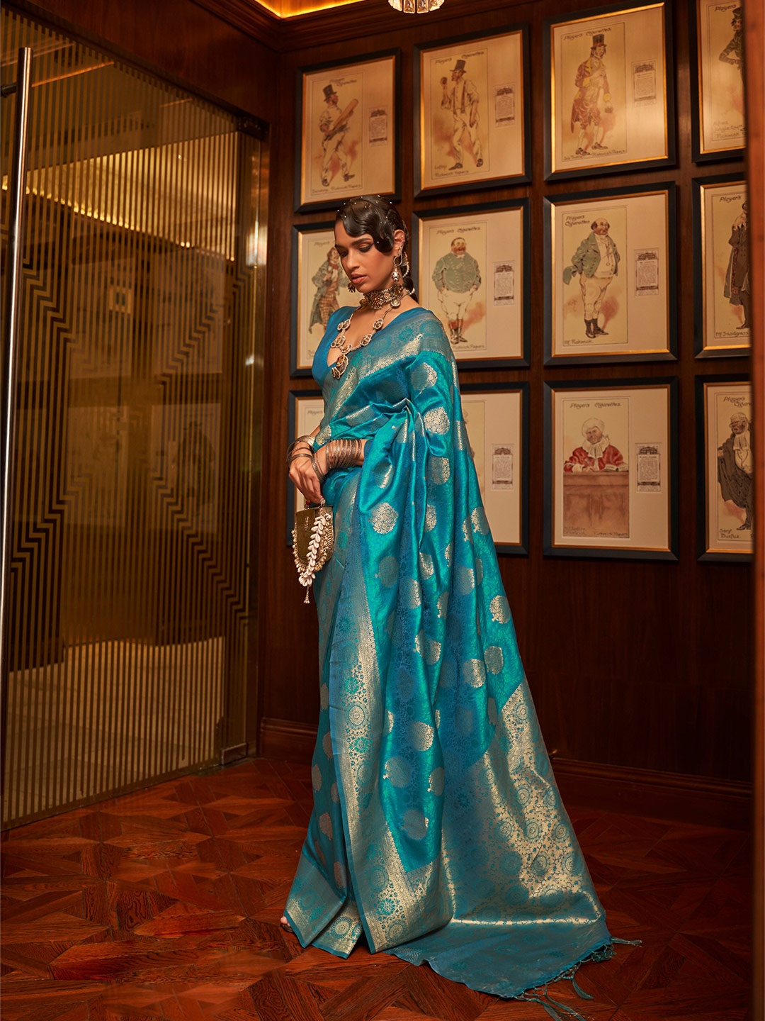 

Mitera Ethnic Motifs Woven Design Zari Silk Blend Saree, Blue