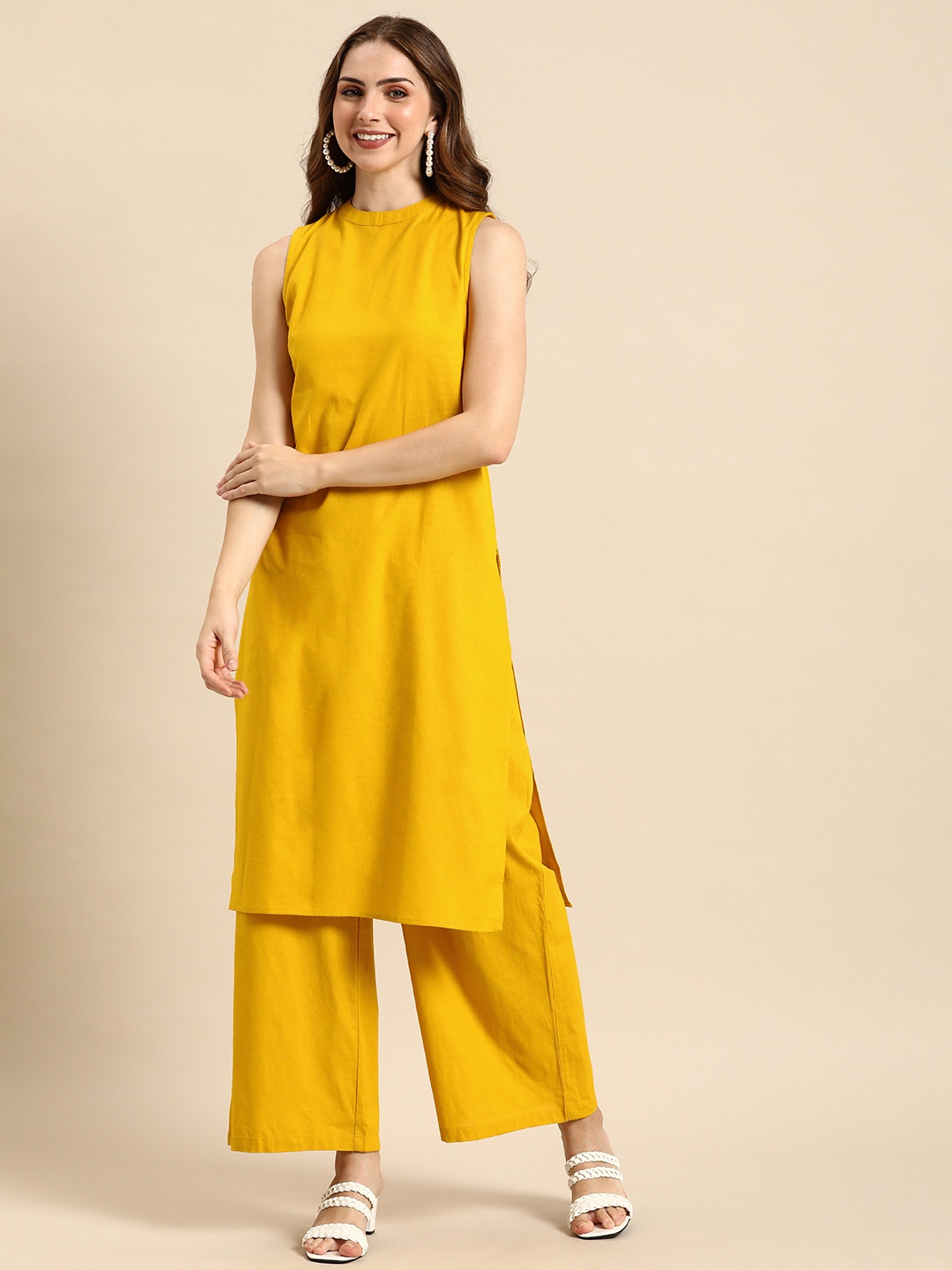 

Anouk Women Solid Round Neck Pure Cotton Kurta, Yellow