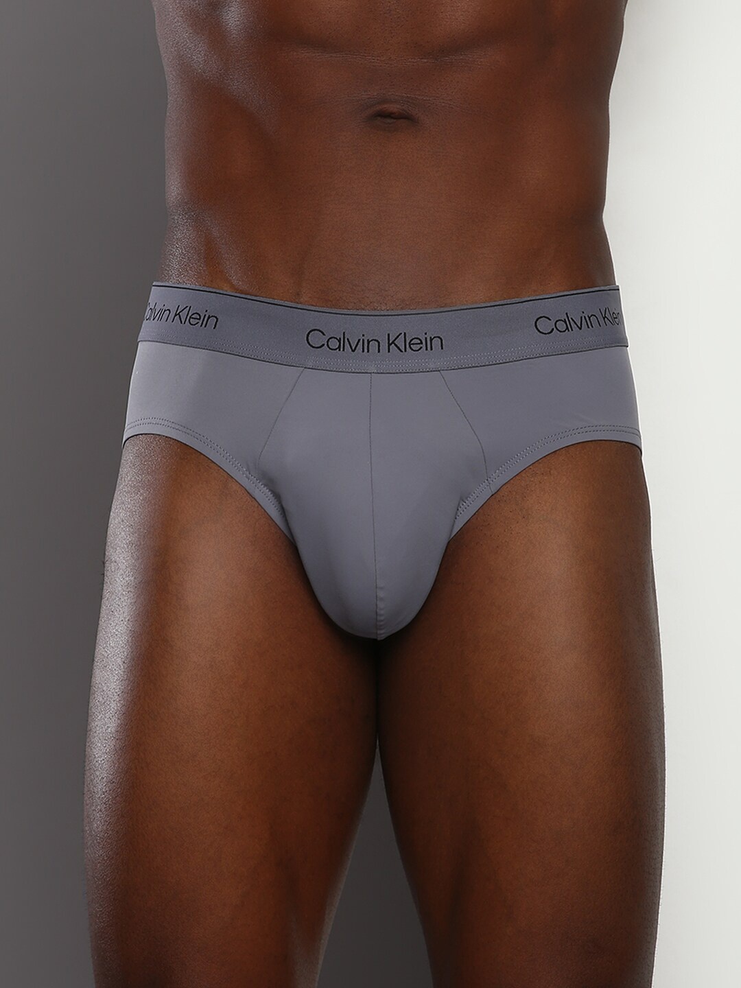 

Calvin Klein Underwear Men Brand Logo Printed Basic Brief, Grey