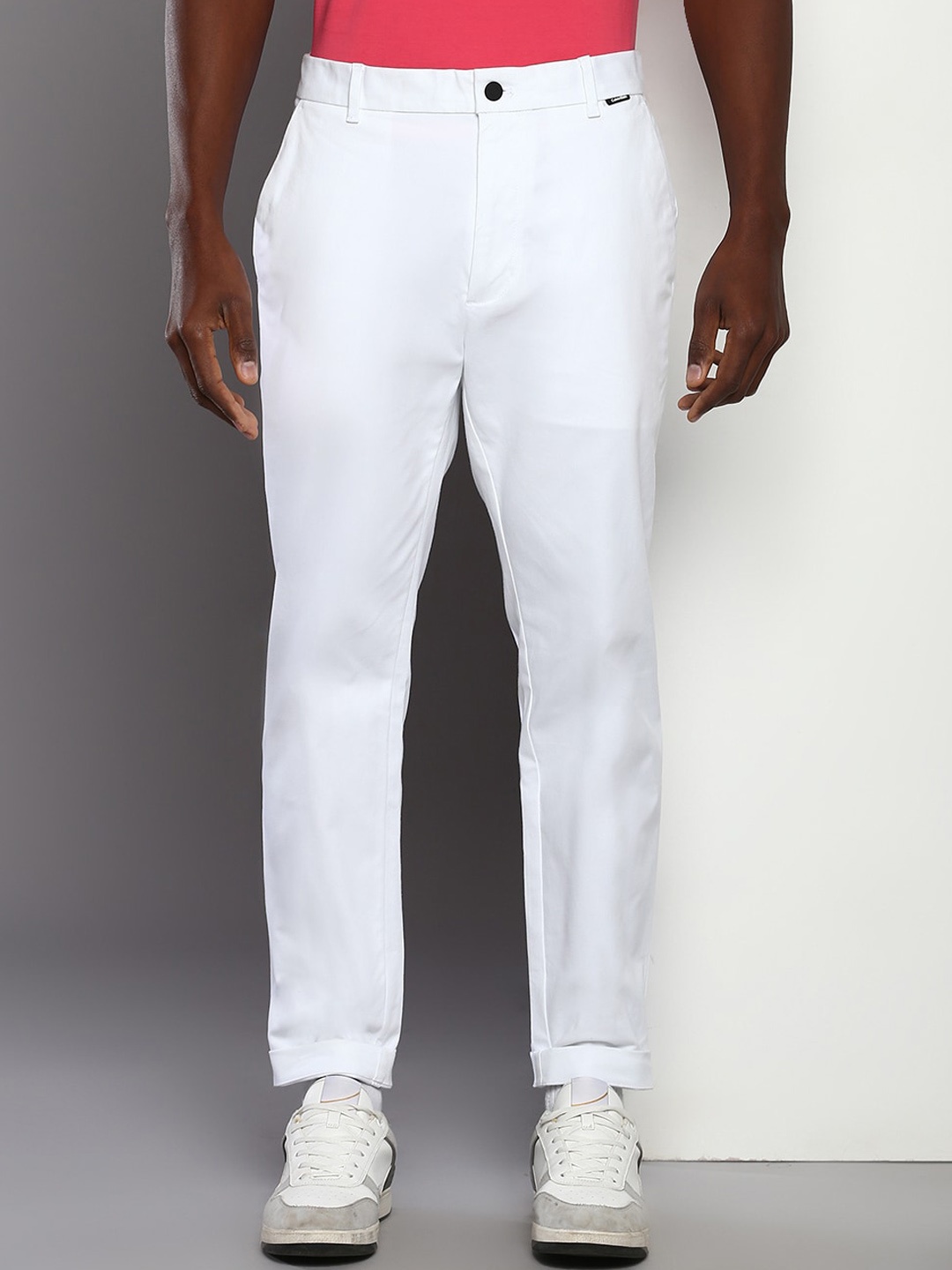 

Calvin Klein Jeans Men Tapered Fit Mid-Rise Casual Trousers, White