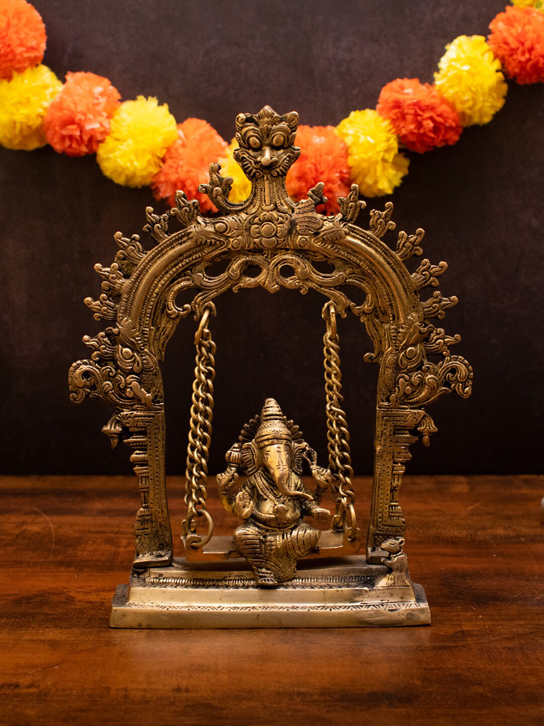 

StatueStudio Gold Toned Ganesha Idol Swing On Jhula Showpieces