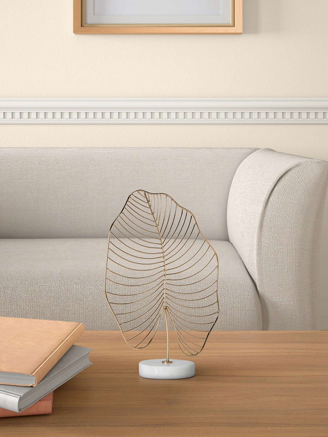 

Living scapes by Pantaloons Gold-Toned Leaf Shape Showpiece