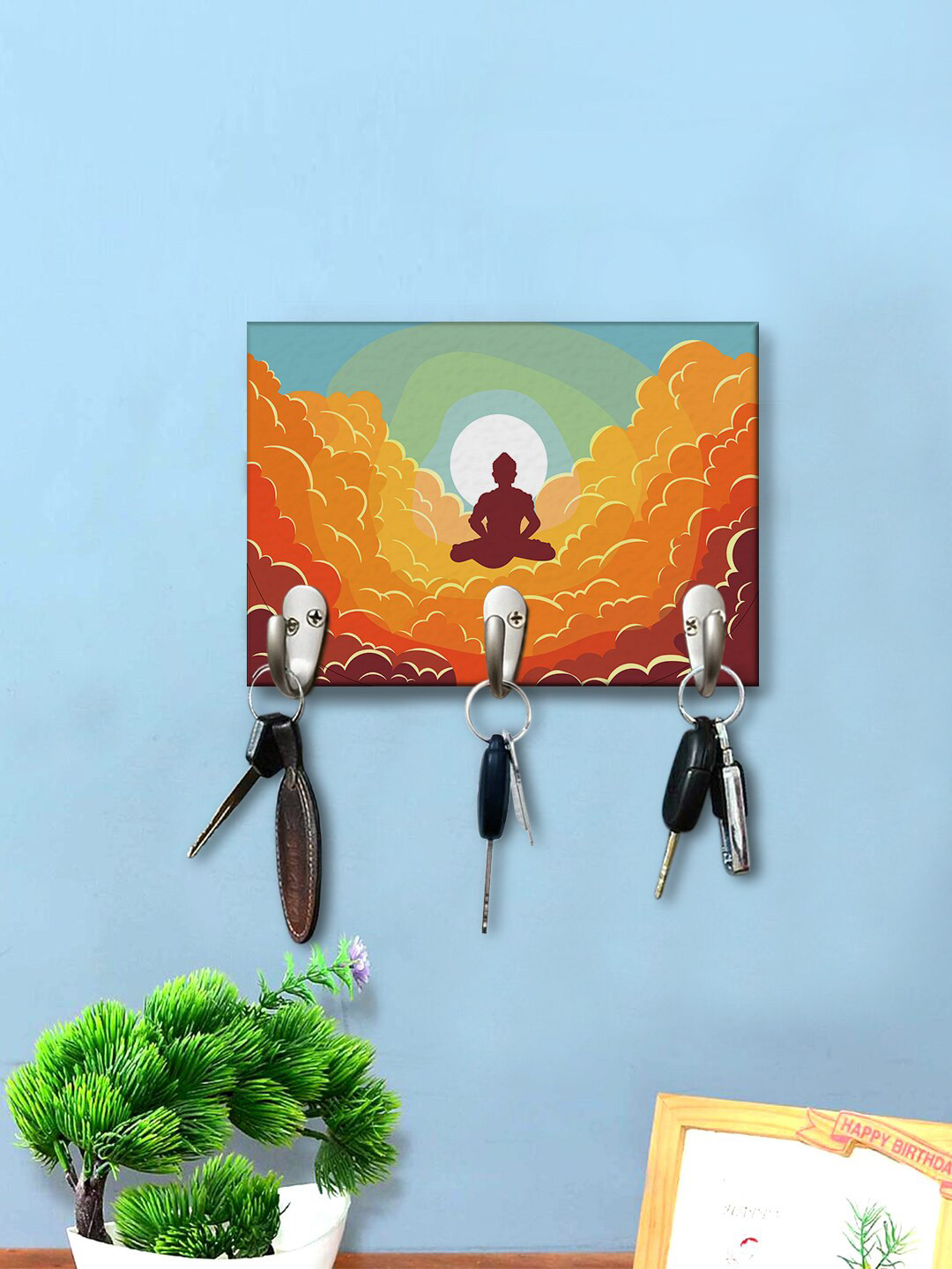 

999Store Orange & Green Buddah On Clouds Printed Key Holder
