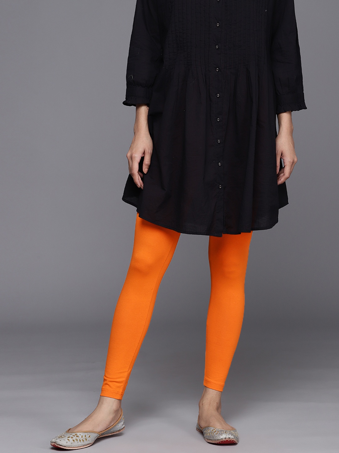

Indo Era Women Solid Skinny Fit Ankle Length Leggings, Orange