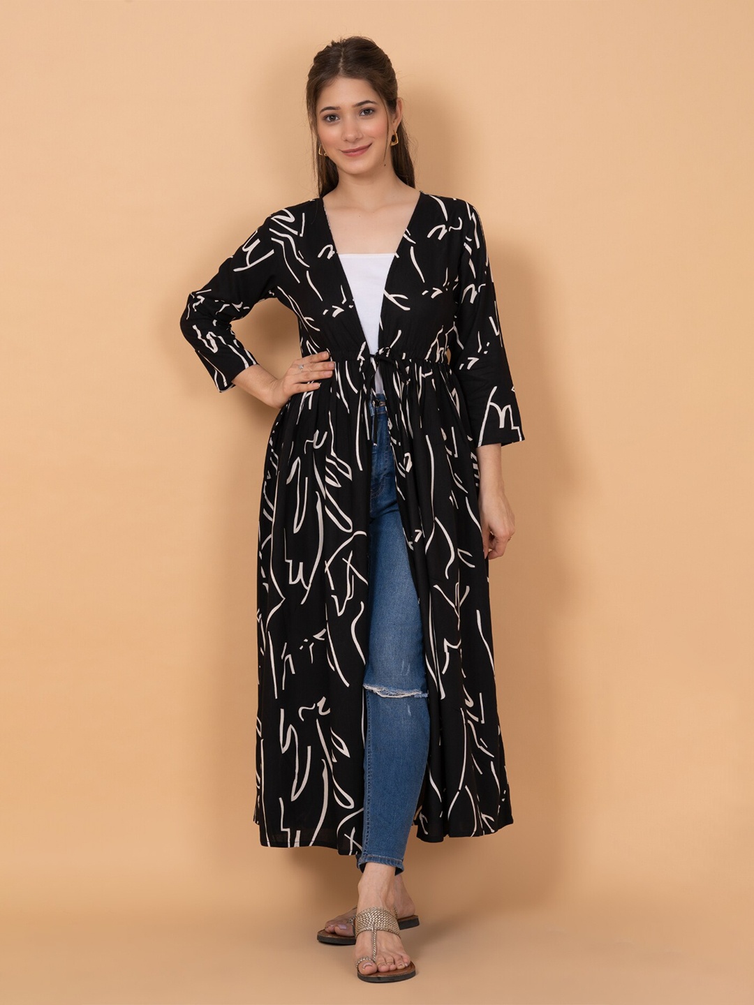 

DAEVISH Women Printed Longline Tie-Up Shrug, Black