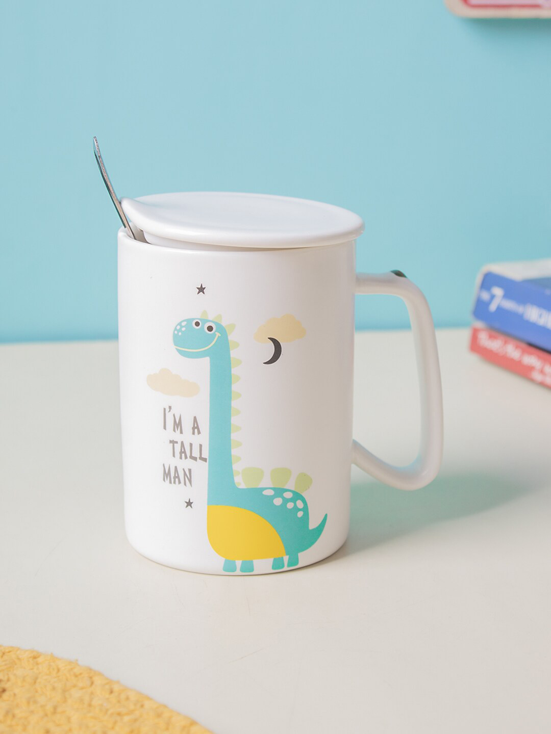 

MARKET99 Off White & Blue Printed Ceramic Glossy Mug With Lid & Spoon 400 ml