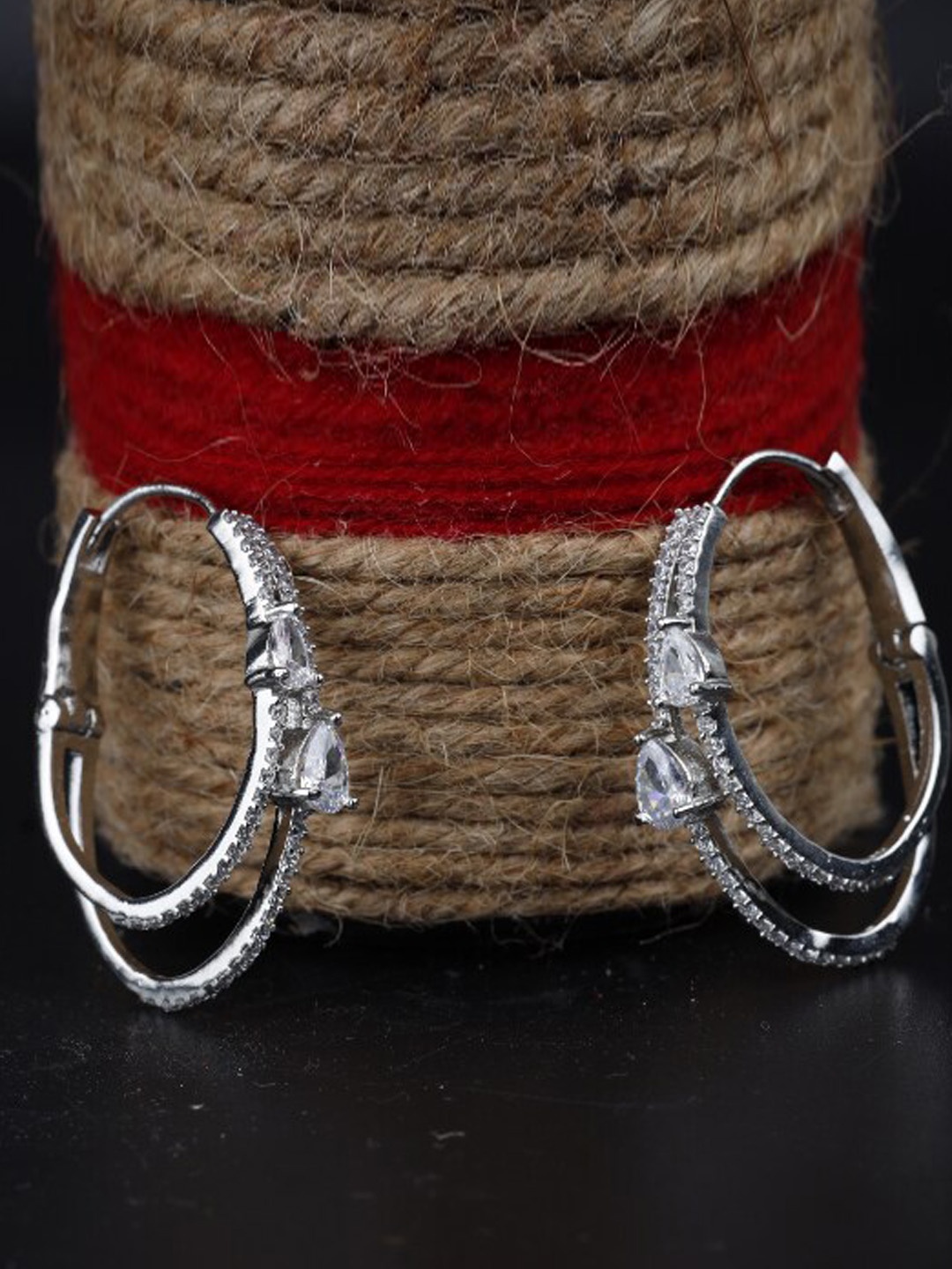 

Kord Store Silver-Plated Oval American Diamond Studded Hoop Earrings