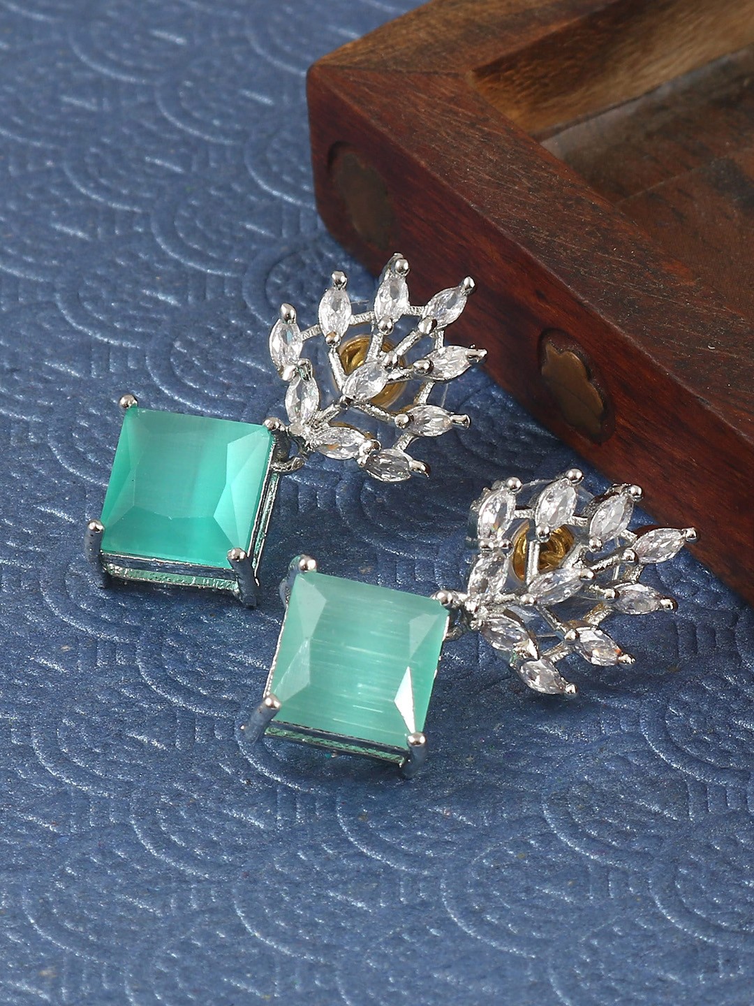 

Jewar Mandi Silver Plated Leaf Shaped Cubic Zirconia Drop Earrings