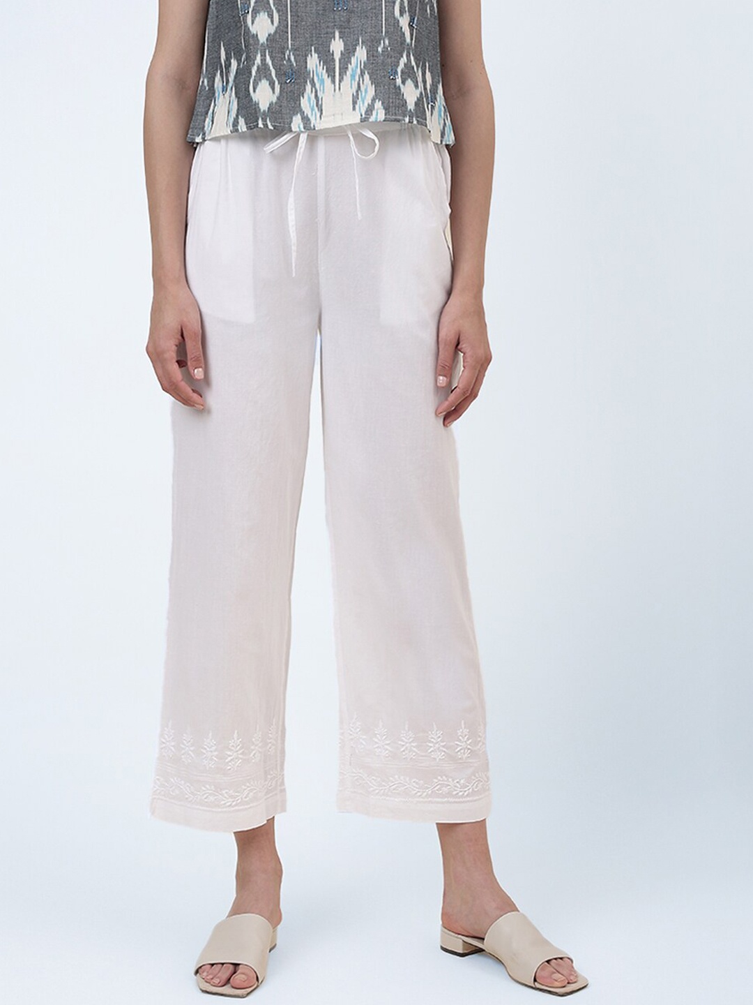 

Fabindia Women Embroidered Parallel Mid-Rise Cotton Trousers, White