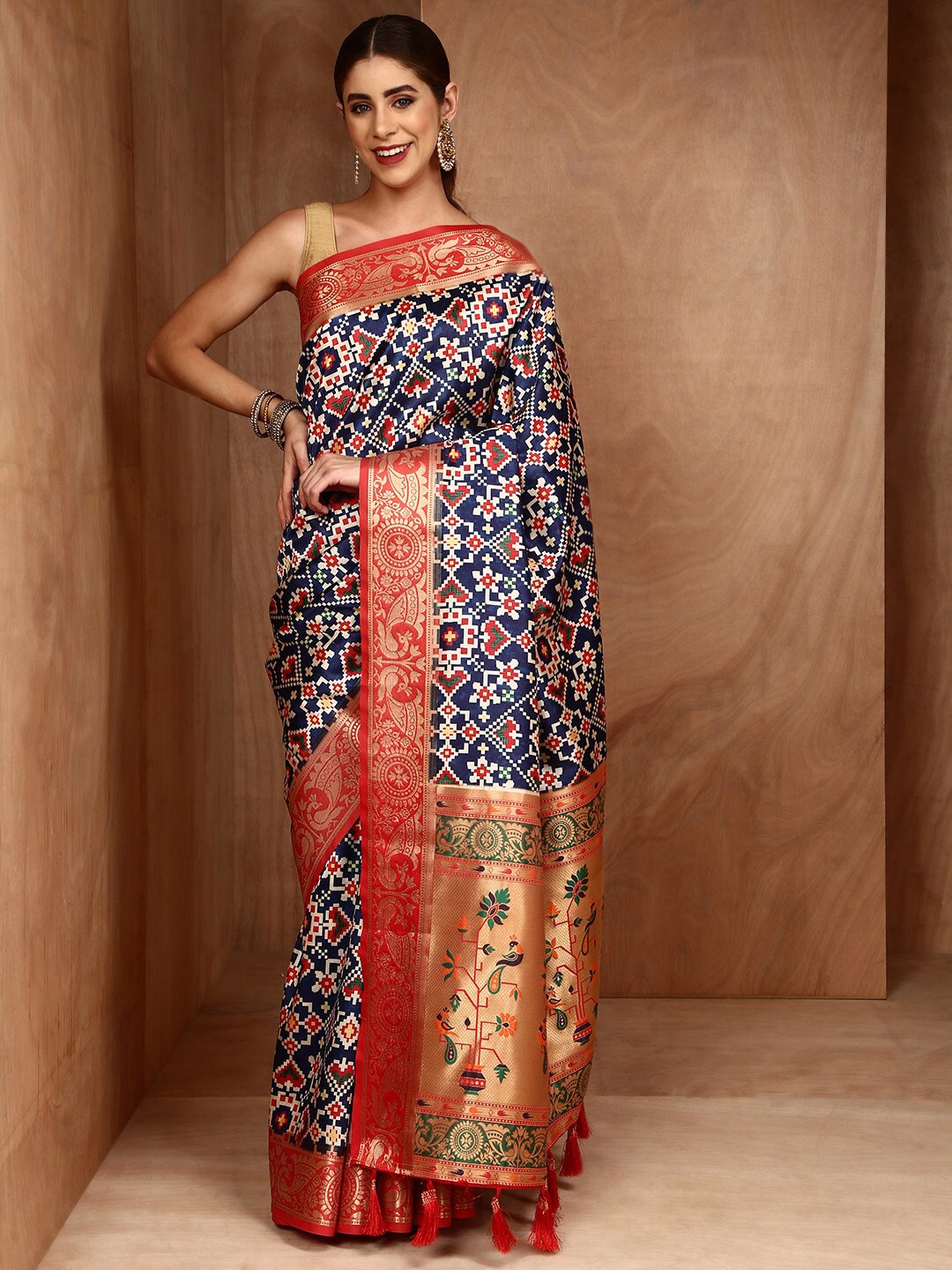 

Anouk Ethnic Motifs Printed Zari Patola Saree, Peach