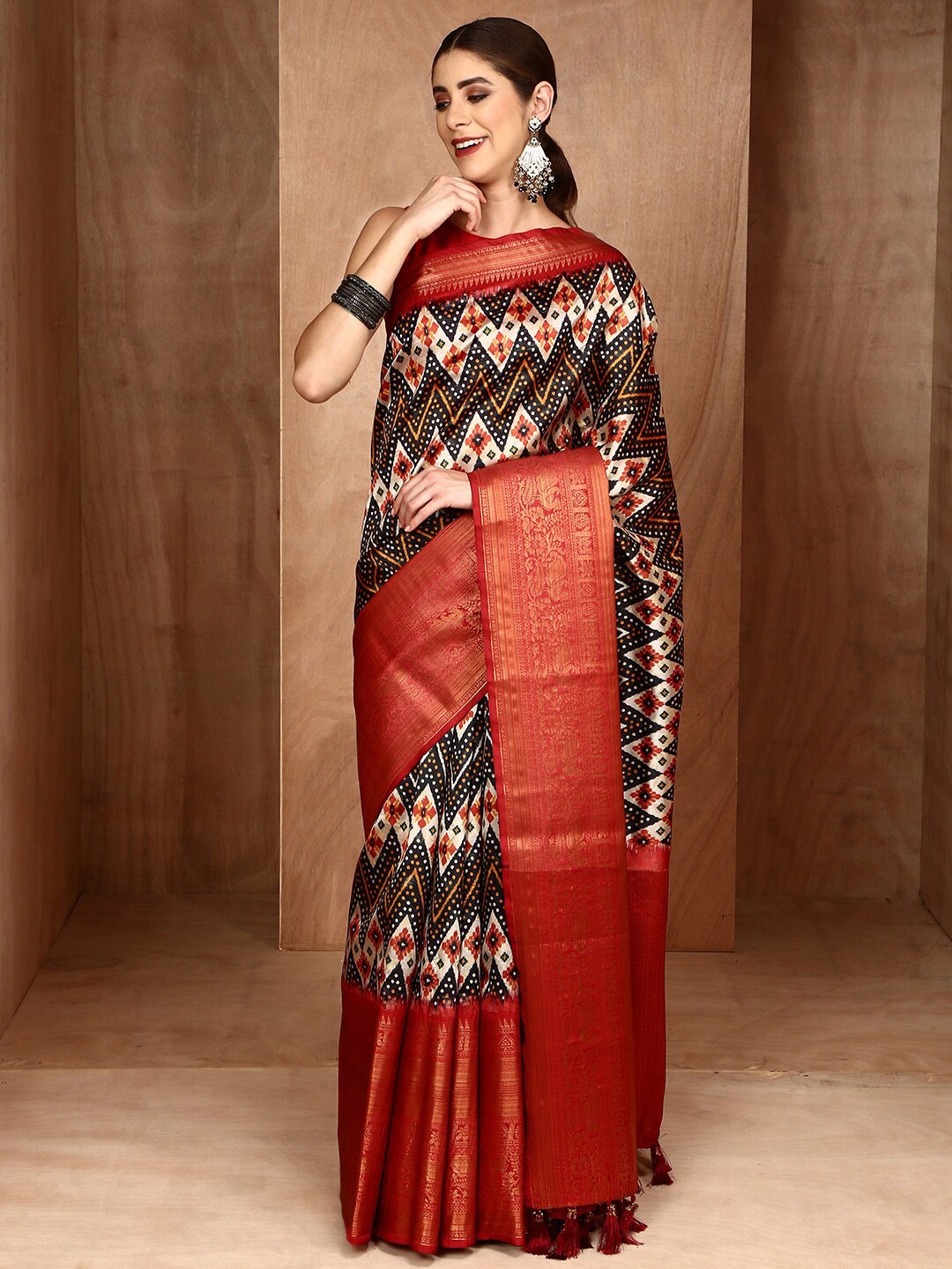 

Anouk Ethnic Motifs Printed Zari Patola Saree, Black
