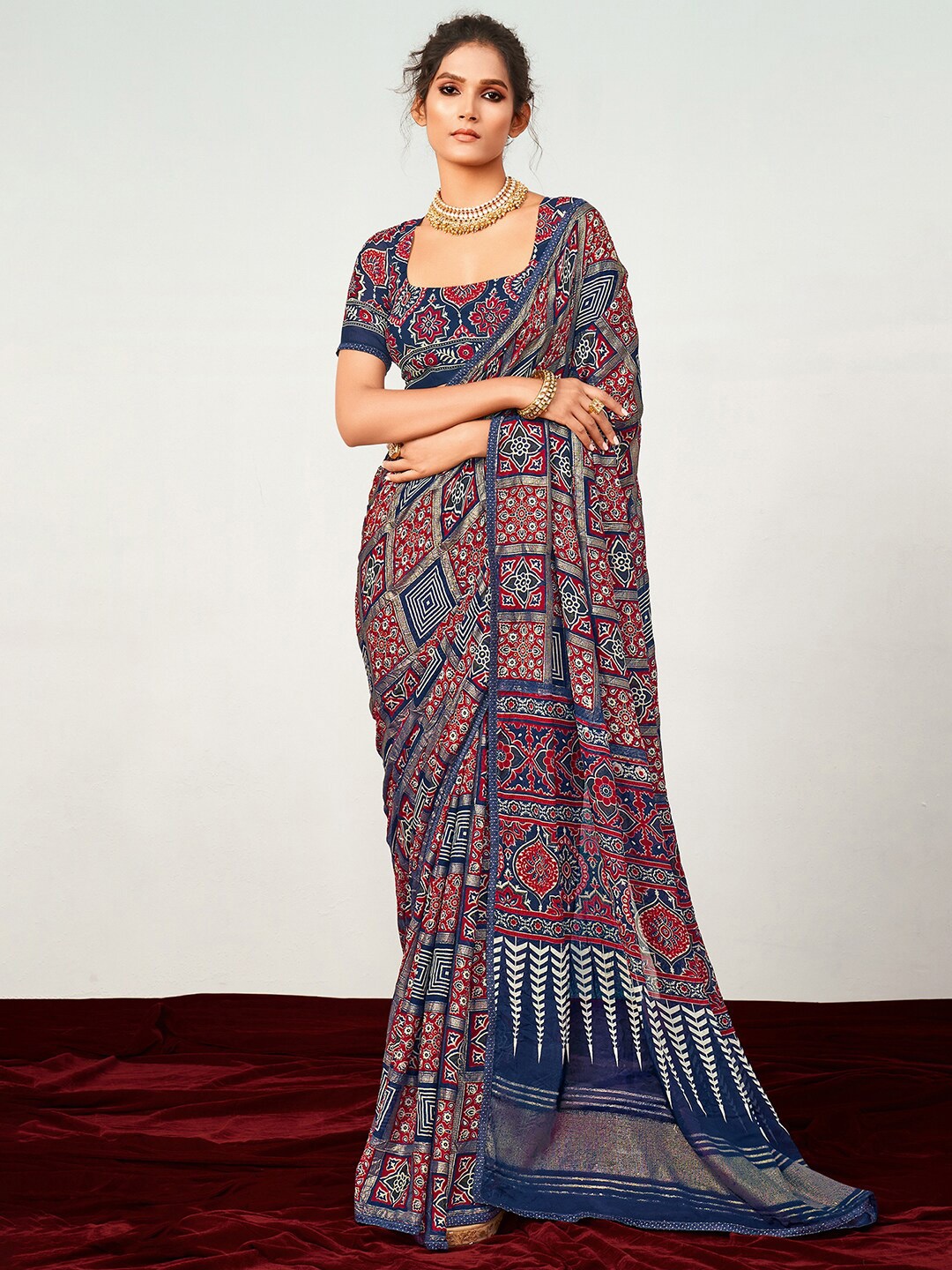 

Saree mall Navy Blue & Red Ethnic Motifs Printed Georgette Saree