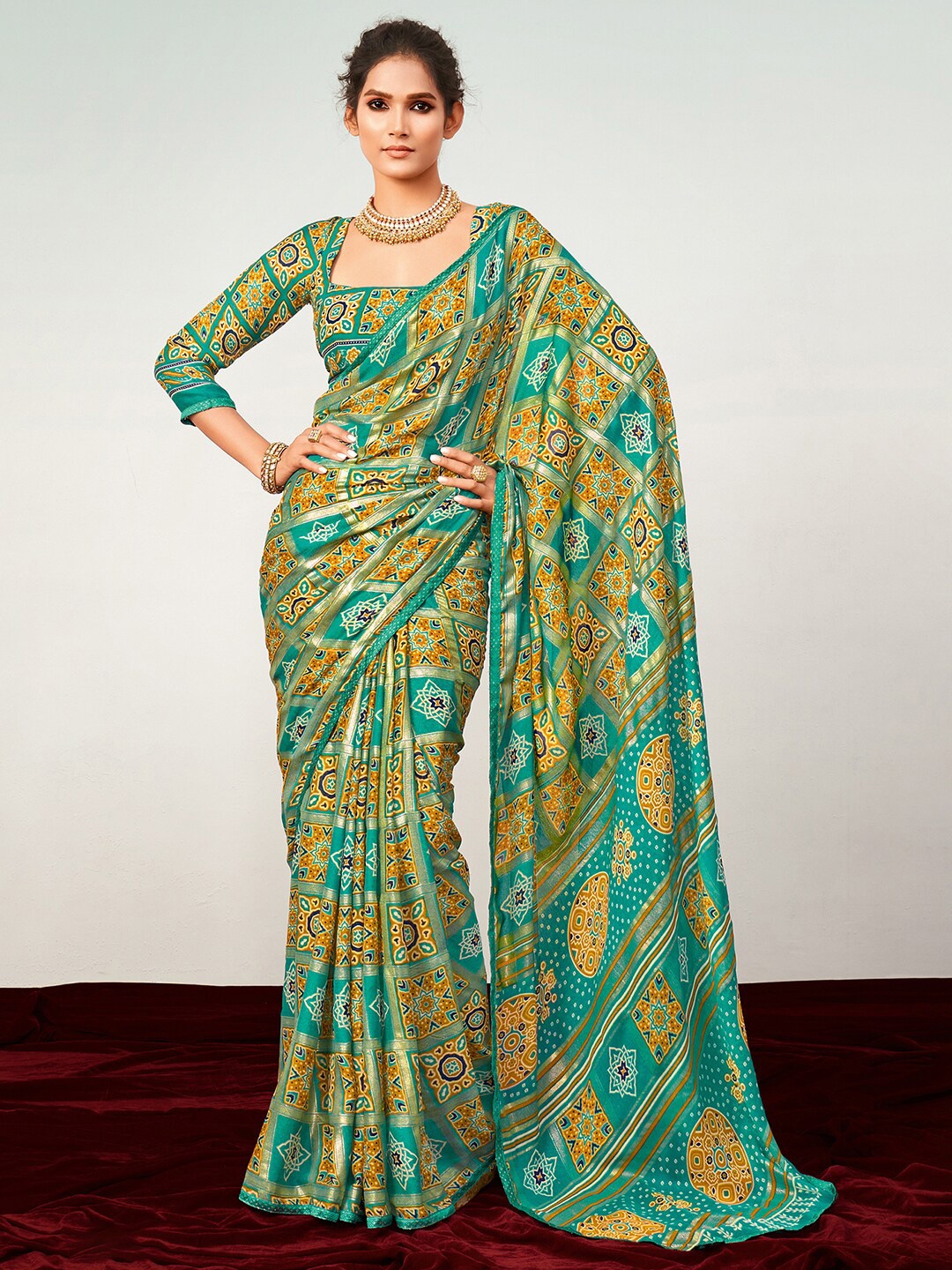 

Saree mall Printed Ajrak Block Zari Pure Georgette Patola Sarees, Turquoise blue