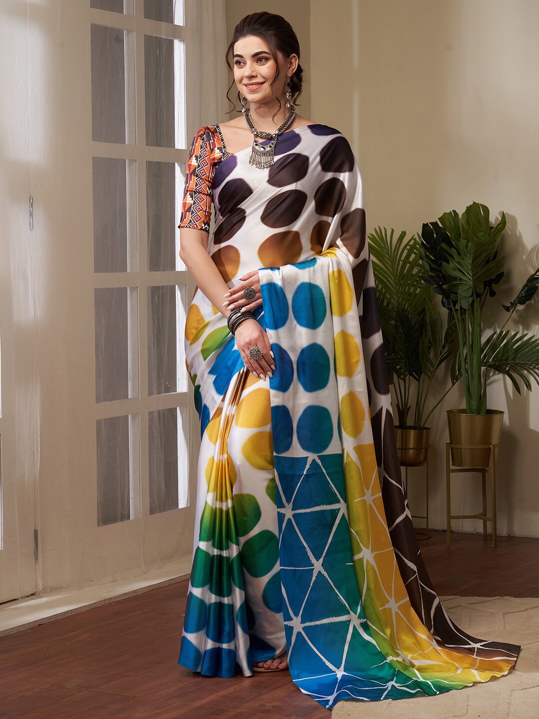 

Saree mall Off White & Brown Graphic Printed Pure Crepe Sarees