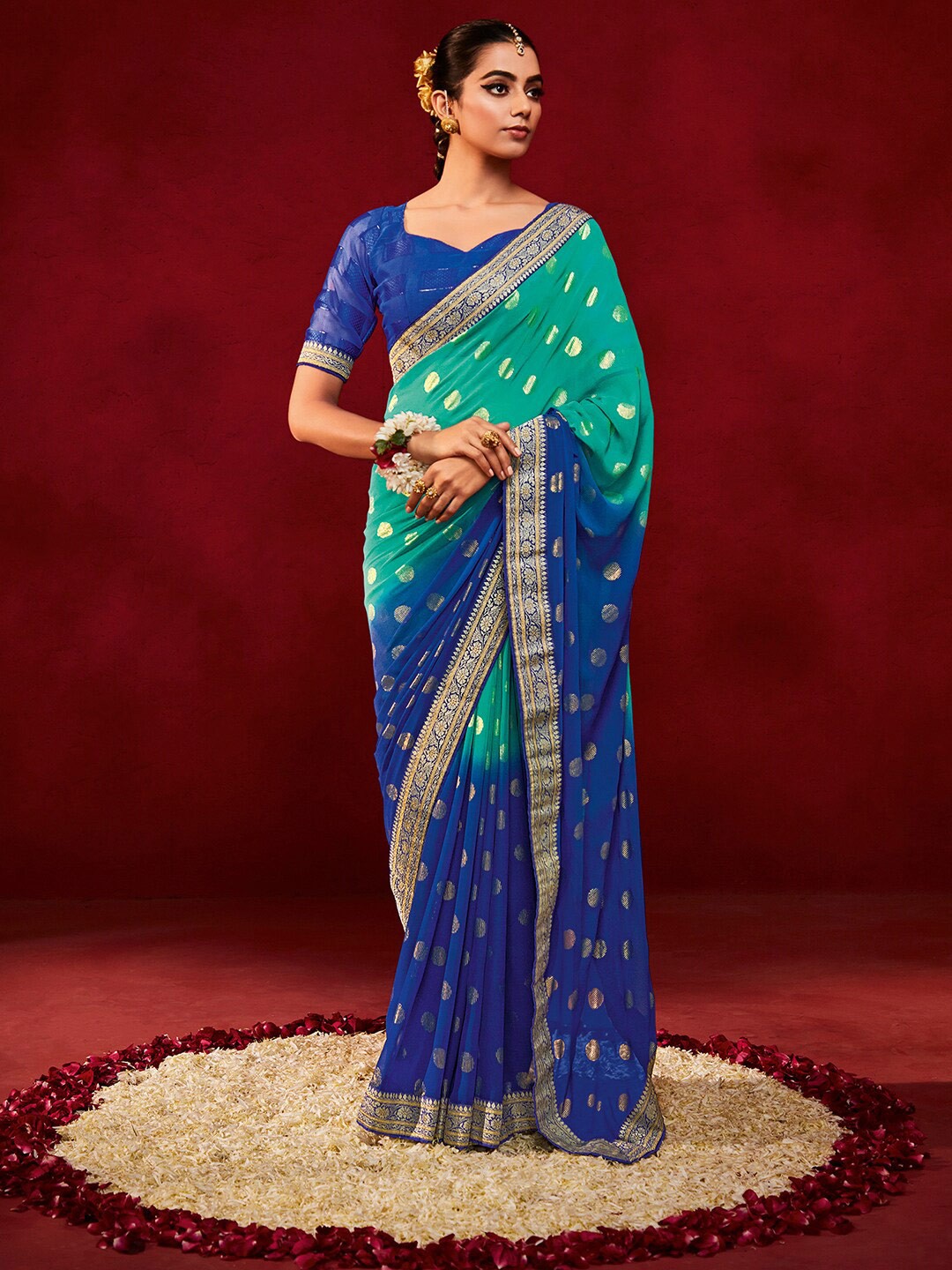 

Saree mall Sea Green & Blue Ethnic Motifs Woven design Pure Georgette Sarees