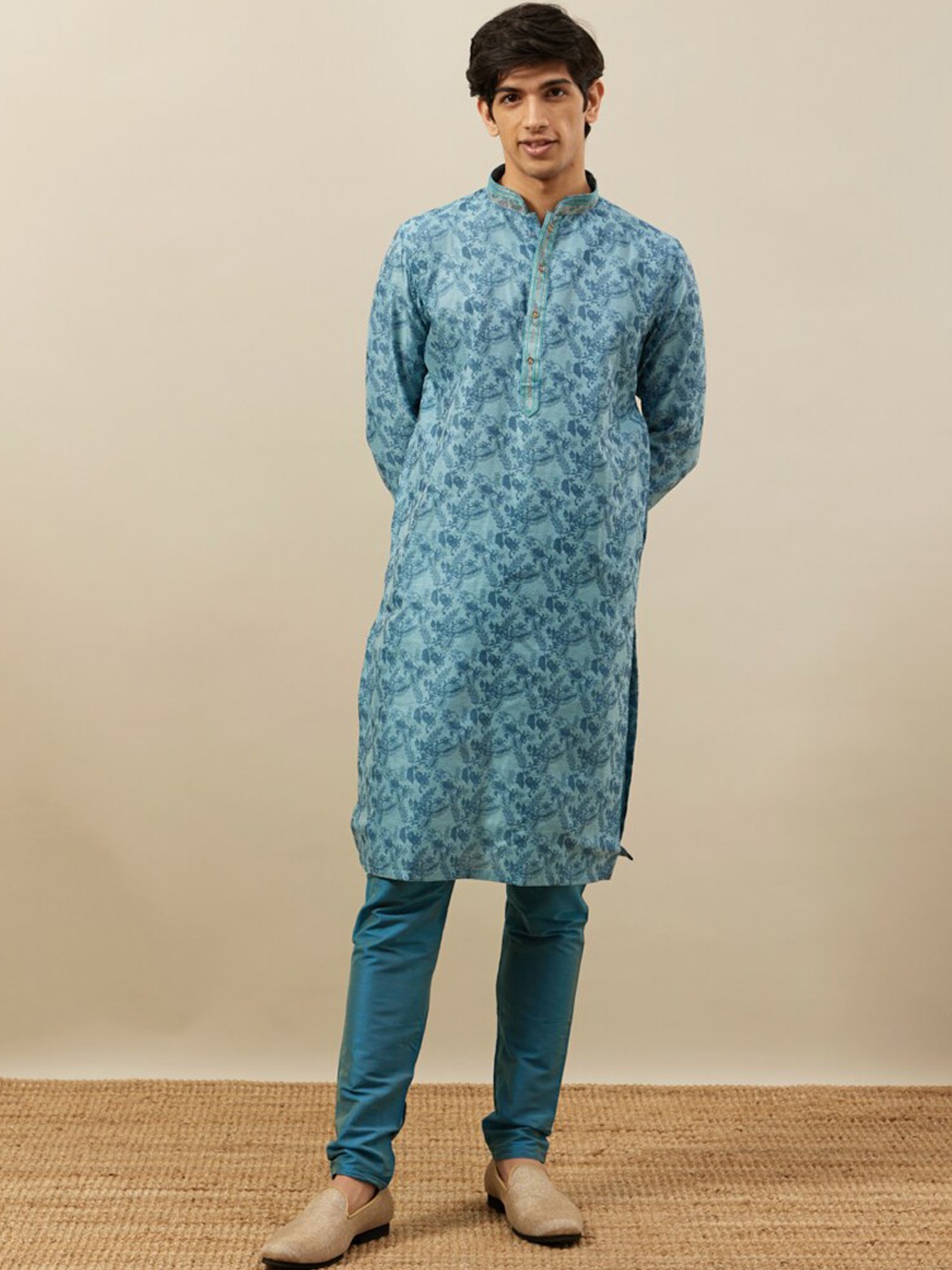 

Manyavar Ethnic Motifs Printed Mandarin Collar Thread Work Kurta With Pyjamas, Turquoise blue