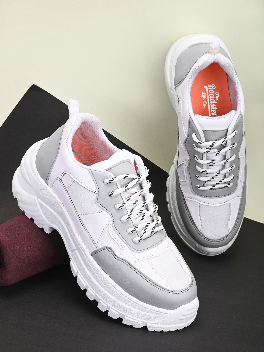 

Roadster Women Grey & White Colourblocked Lightweight Padded Contrast Sole Sneakers