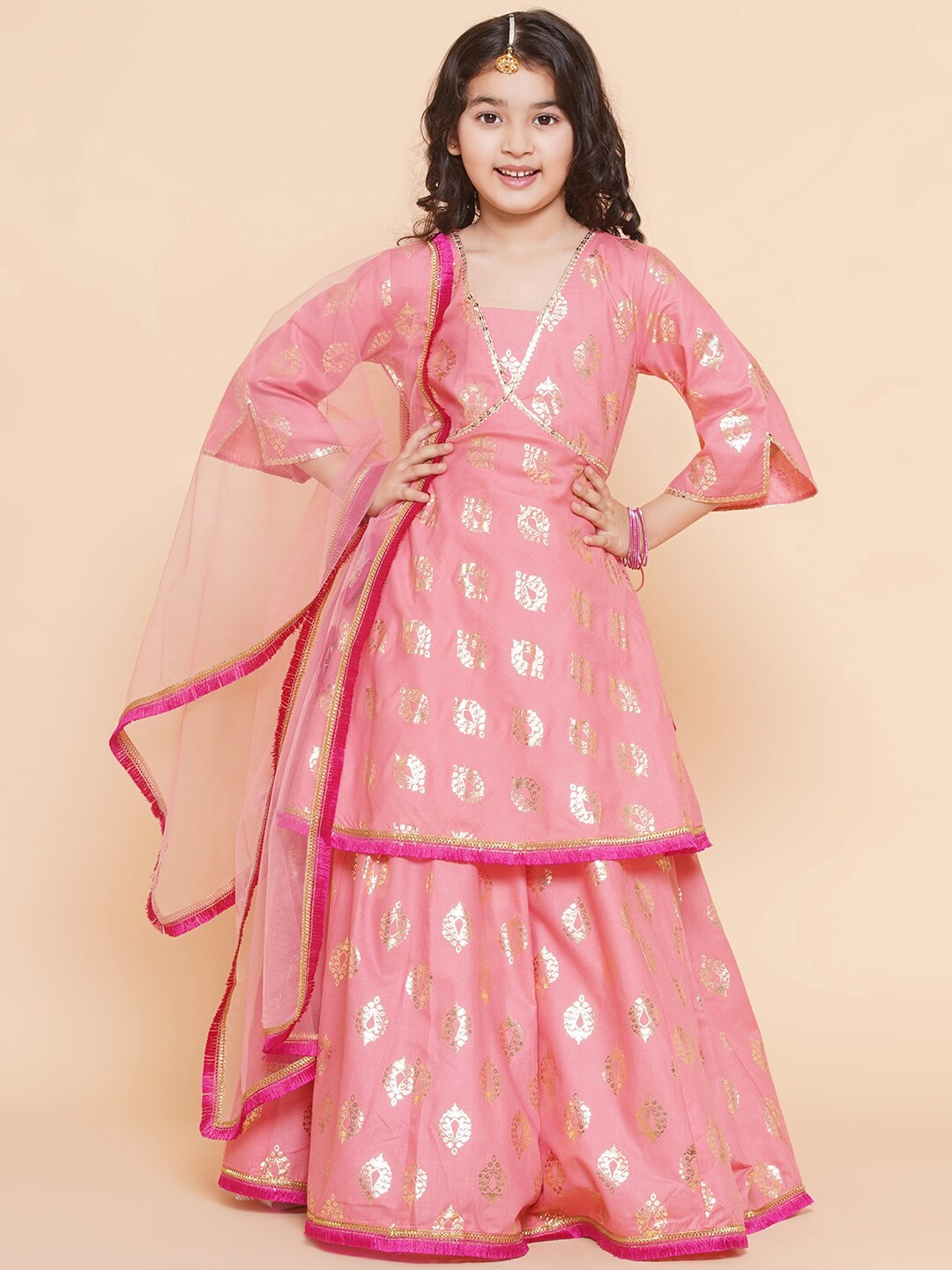 

Bitiya by Bhama Girls Foil Printed V-Neck Lehenga & Blouse With Dupatta, Peach
