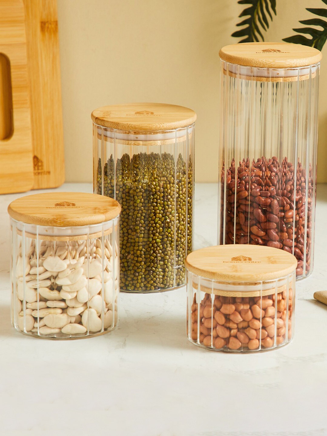

Home Centre Transparent & Brown Striped Glass Canister With Bamboo Lid-700ml
