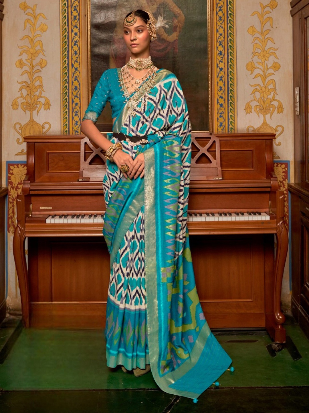 

Mitera Blue & Gold-Toned Ethnic Motifs Printed Zari Patola Saree